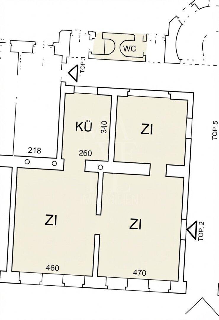 Grundriss einer Wohnung mit drei Zimmern und einer Küche, inklusive Maßen und separatem WC-Bereich.
