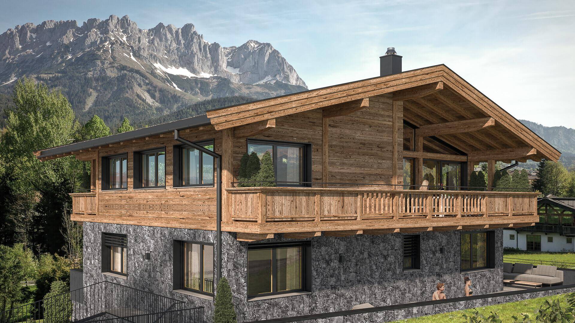Alpines Chalet mit Holzfassade und Steinsockel, umgeben von Bergen und grüner Landschaft.