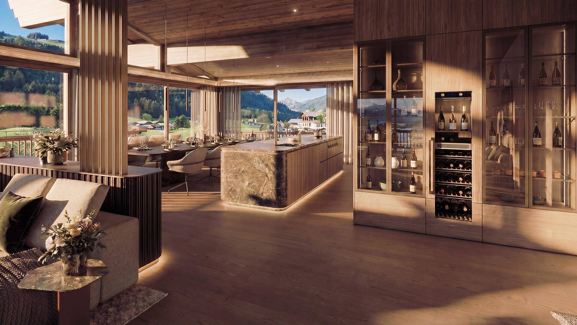 Eleganter Essbereich mit offener Küche, Weinkühler und Panoramablick auf die umliegenden Berge.