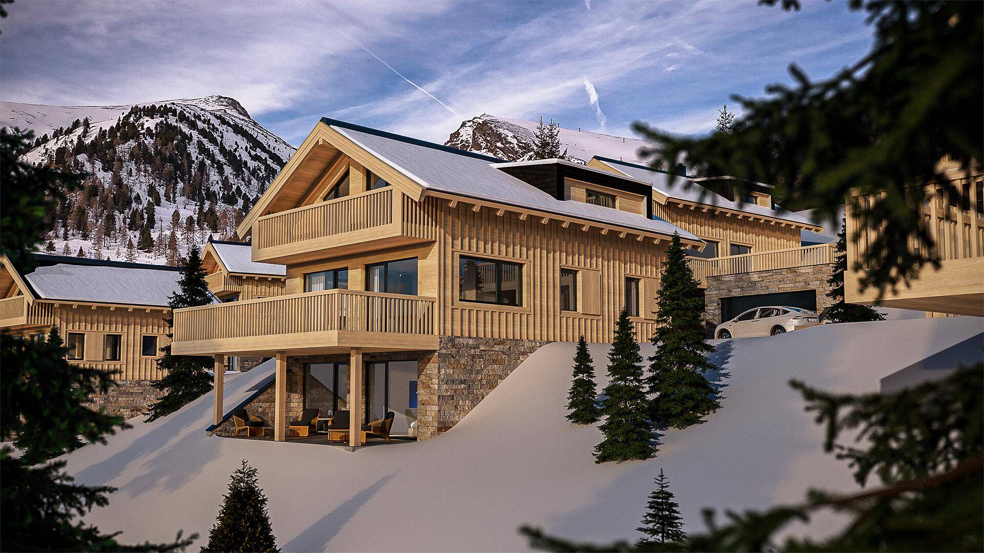 Modernes Holzchalet mit Balkonen und verschneiter Umgebung vor einer Bergkulisse.