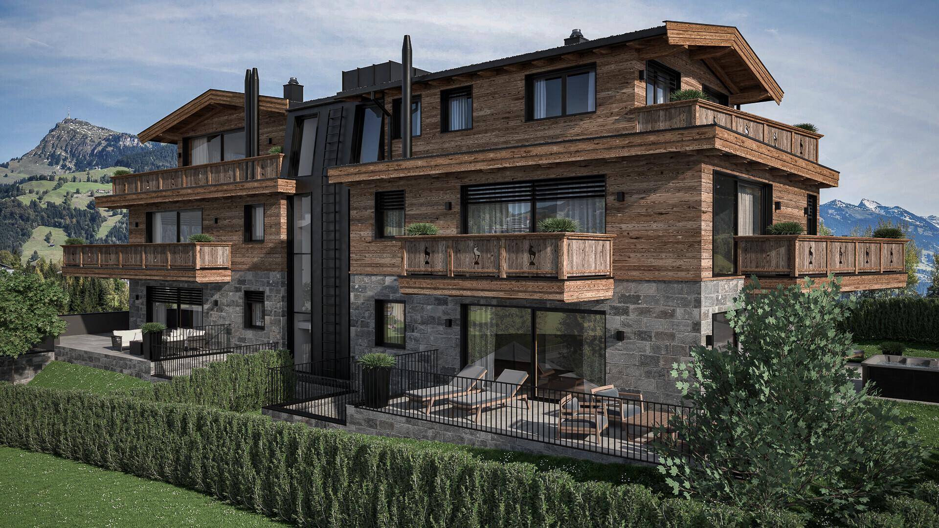 Alpines Neubauprojekt mit Holzfassade, Steinverkleidung und mehreren Terrassen mit Bergblick.