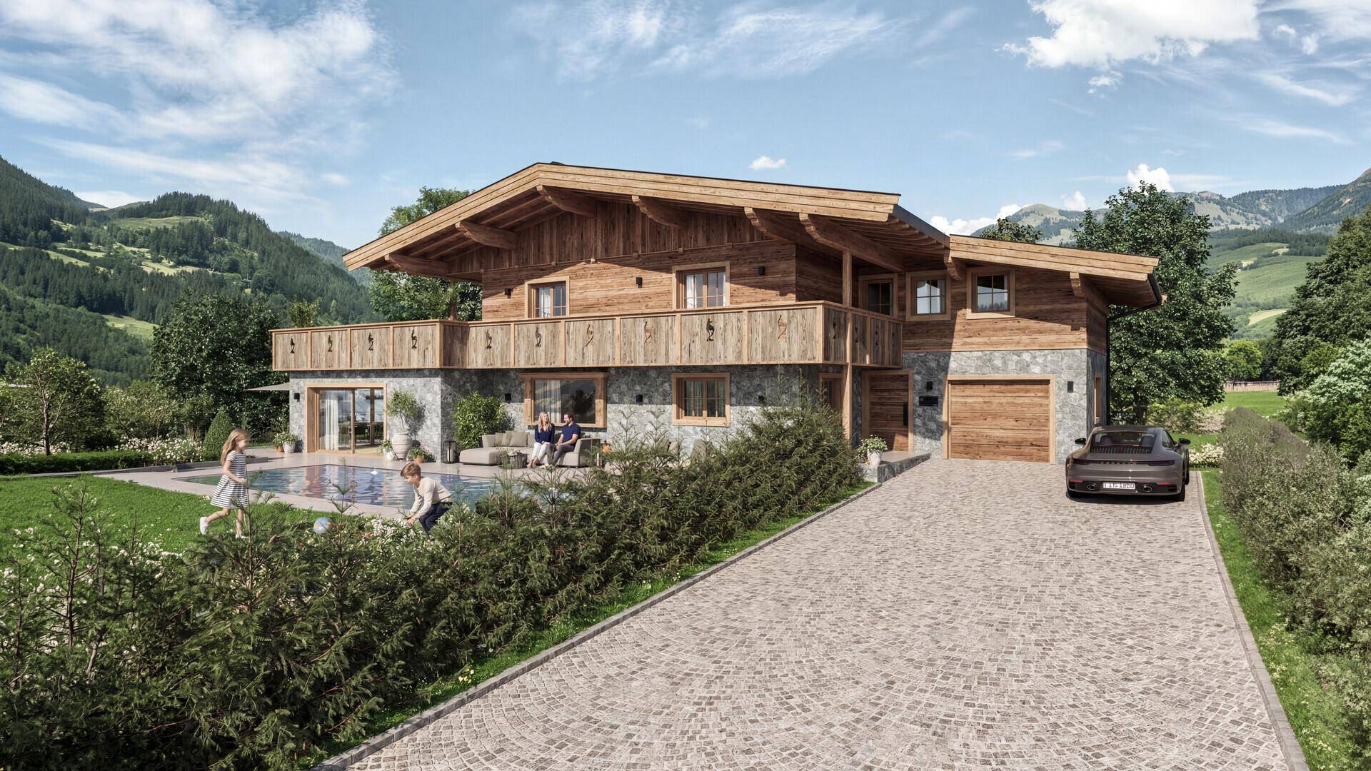 Ansicht des luxuriösen Chalets mit gepflasterter Auffahrt, Poolbereich und Bergblick im Sommer.