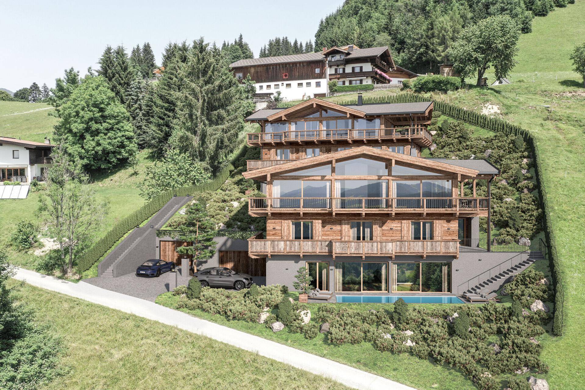 Panoramablick auf ein luxuriöses Holzchalet mit Infinity-Pool und weitläufiger Berglandschaft.