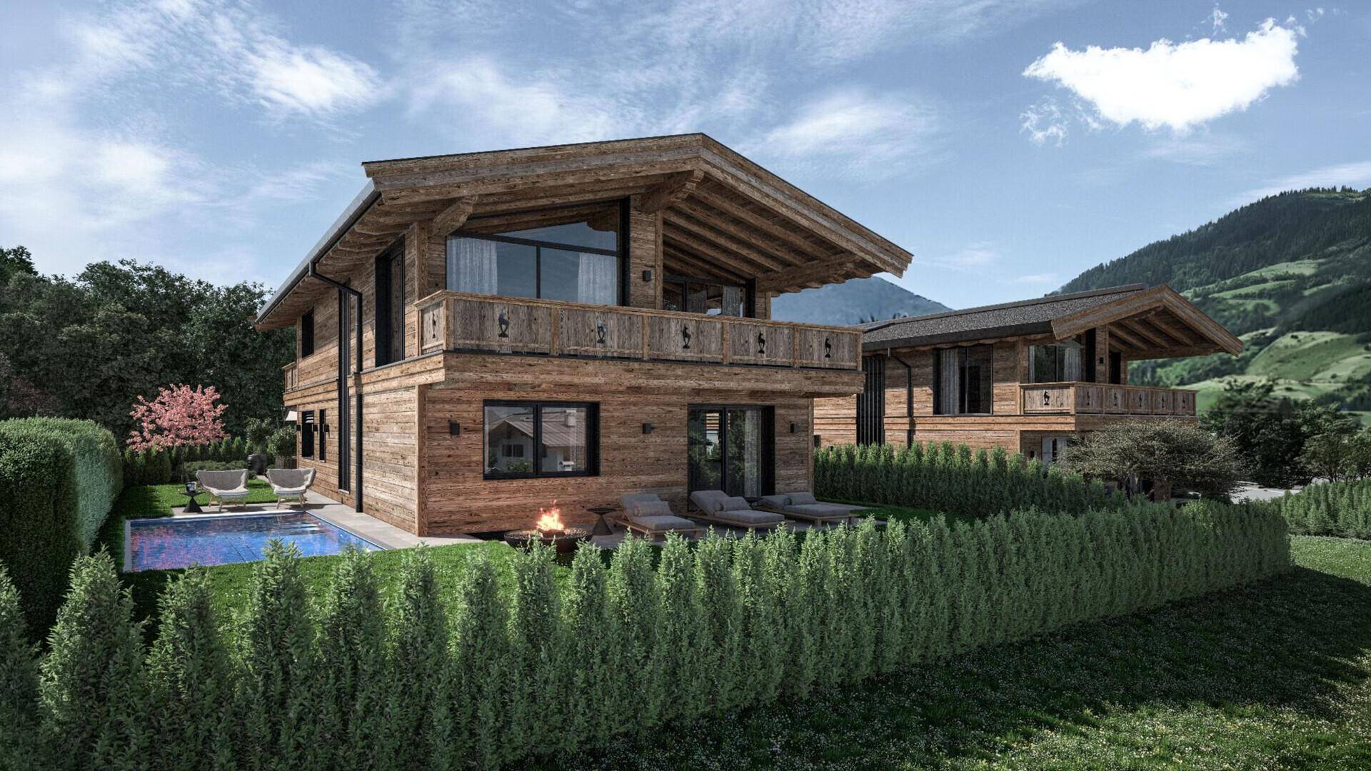 Modernes Holzchalet mit privatem Pool, Liegebereich und Feuerstelle im Garten mit Bergblick.