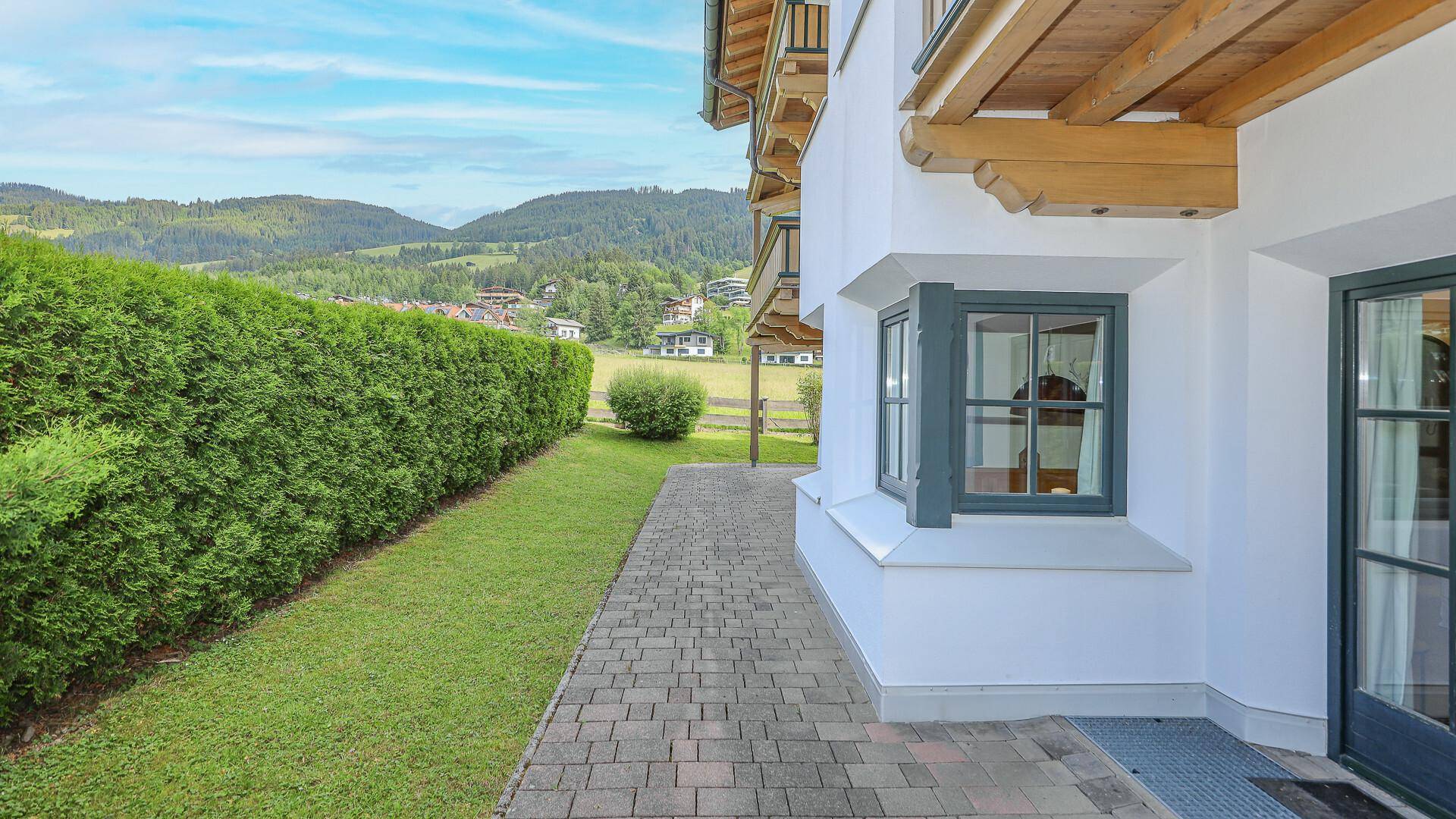 KITZIMMO-Exklusive Gartenwohnung in sonniger Ruhelage - Immobilien Kirchberg.
