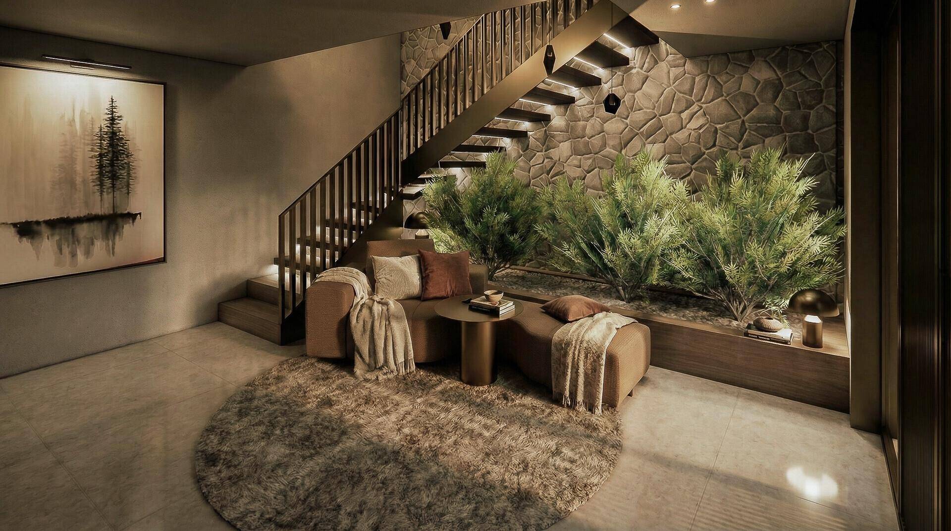 Gemütlicher Lounge-Bereich unter einer Treppe mit Steinwand, Pflanzen und weichem Teppich.