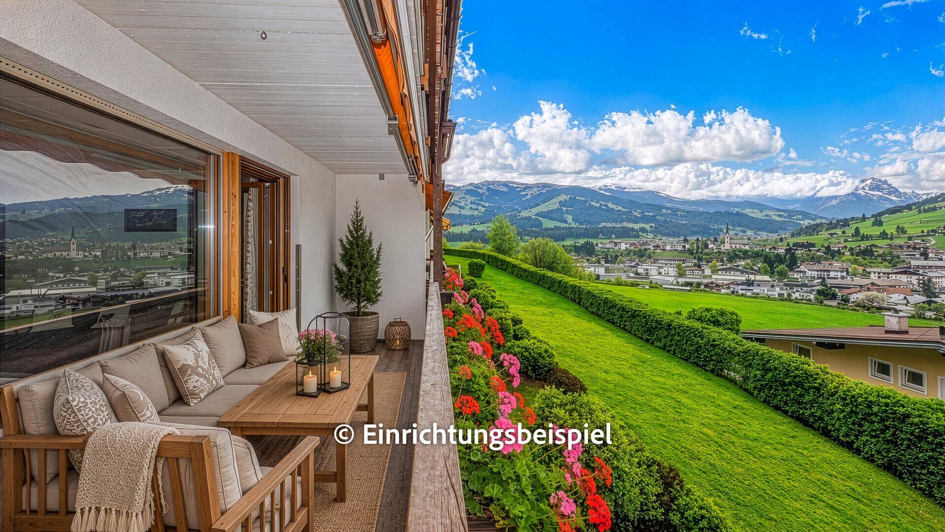 Gemütlicher Balkon mit Lounge-Möbeln, ideal zum Entspannen mit Bergblick.