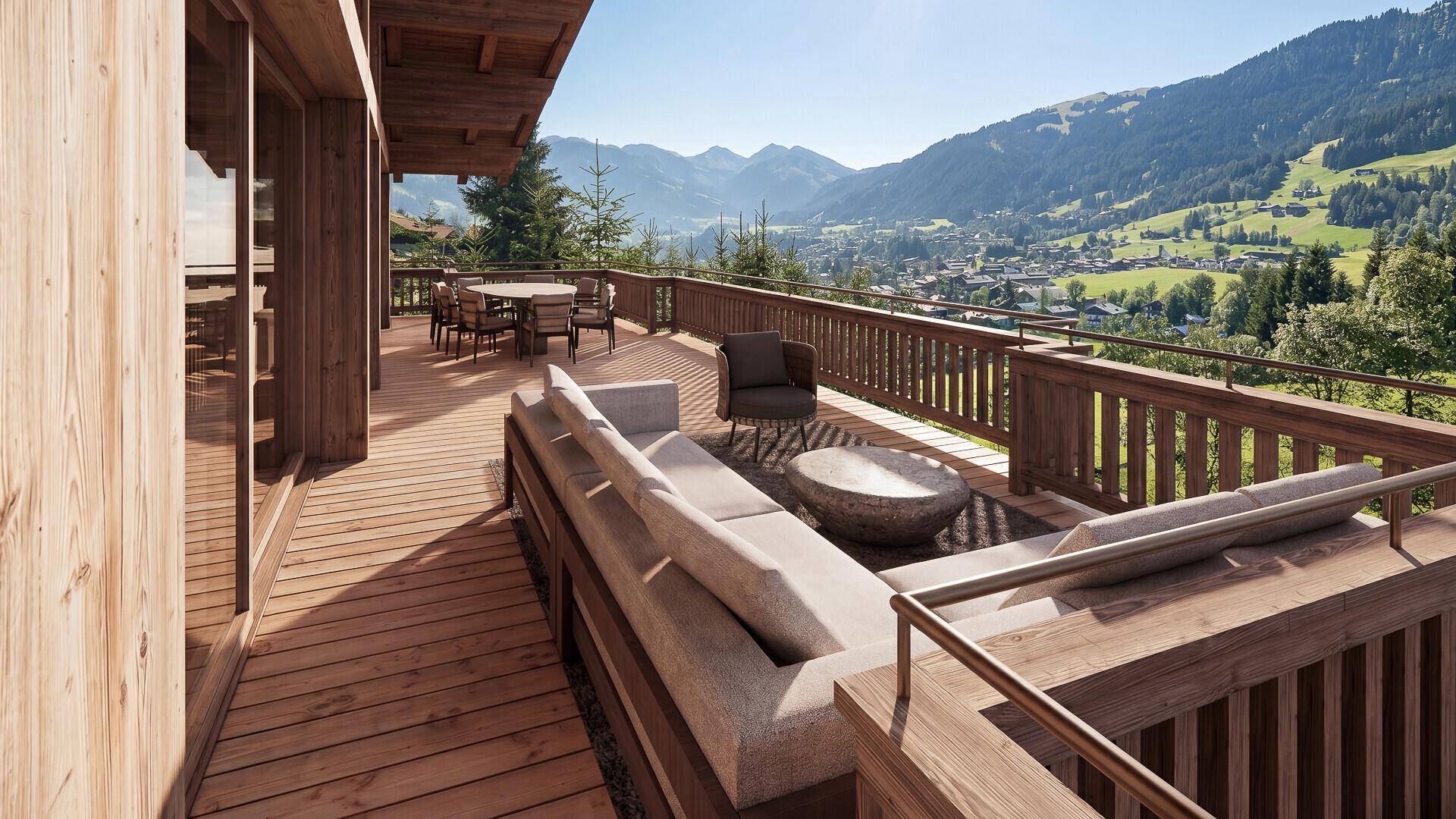 Geräumiger Holzbalkon mit Lounge-Möbeln und Esstisch, ideal für entspannte Stunden mit Bergblick.