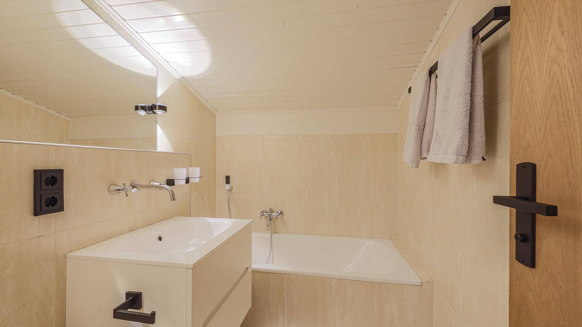 KITZIMMO-Dachgeschosswohnung mit Lift und Tiefgarage im Zentrum - Immobilien Kitzbühel.