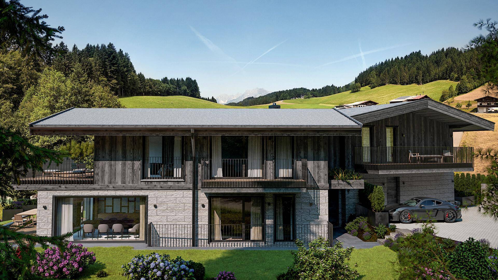 Elegantes Haus mit moderner Architektur, großen Fensterfronten und Blick auf die umliegende Berglandschaft.