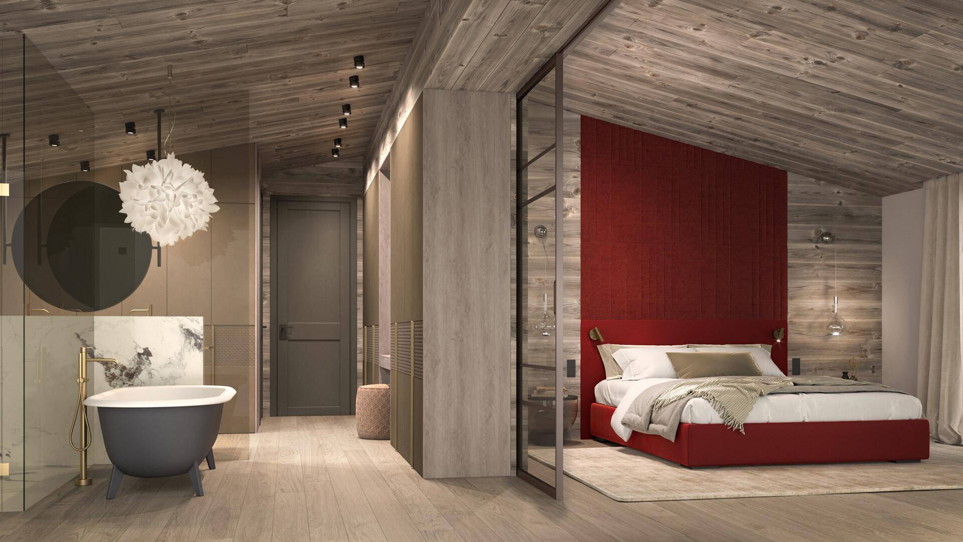 Schlafzimmer mit roter Akzentwand, offenem Badbereich und freistehender Badewanne unter Dachschräge.
