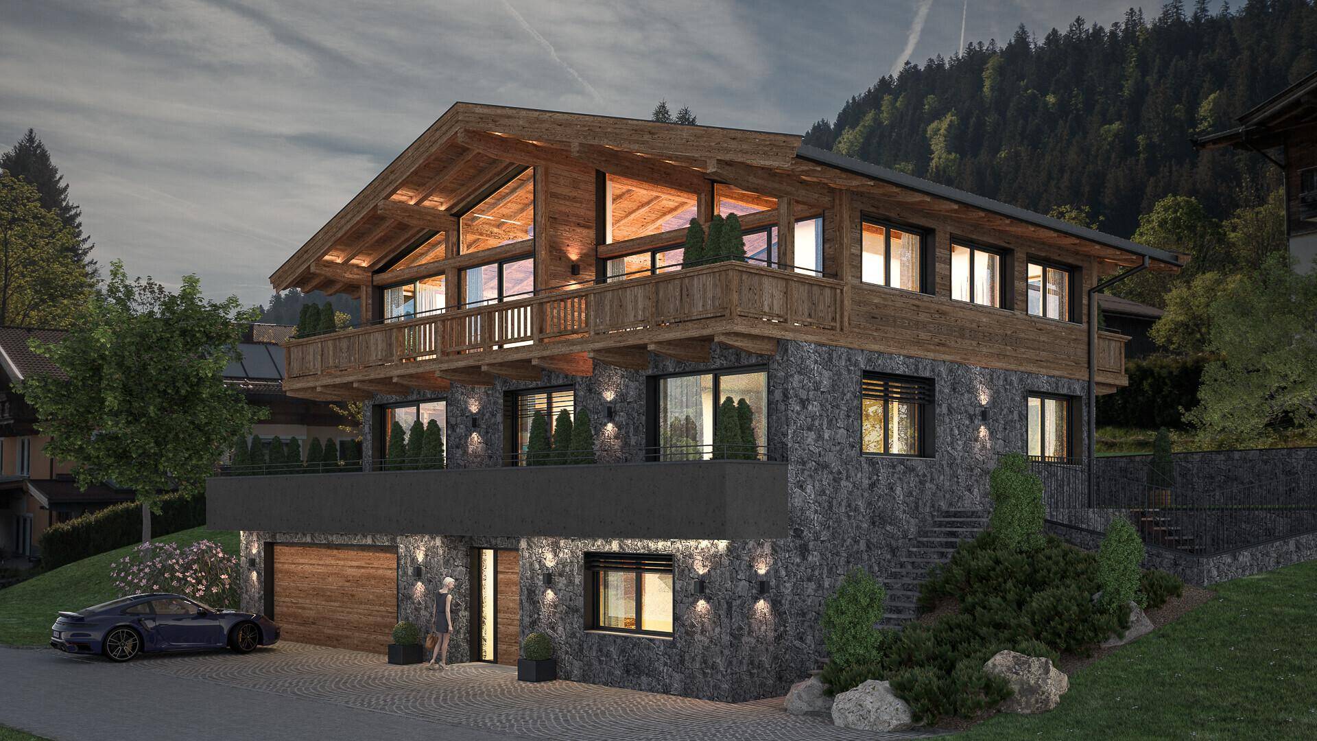 Alpines Chalet bei Dämmerung mit beleuchteter Fassade und warmem Licht aus den Fenstern.