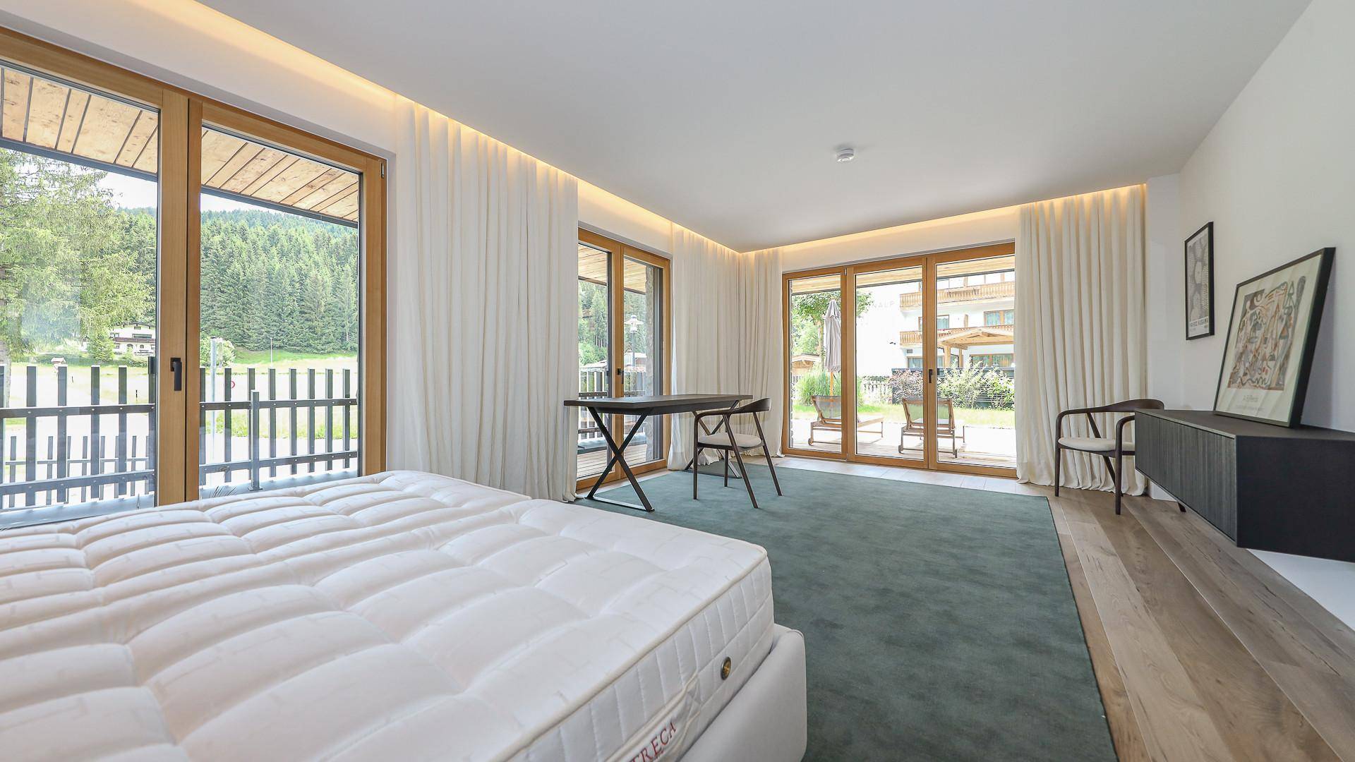 KITZIMMO-Riverside - Luxus-Garden-Suite in Toplage kaufen - Immobilien Kirchberg.