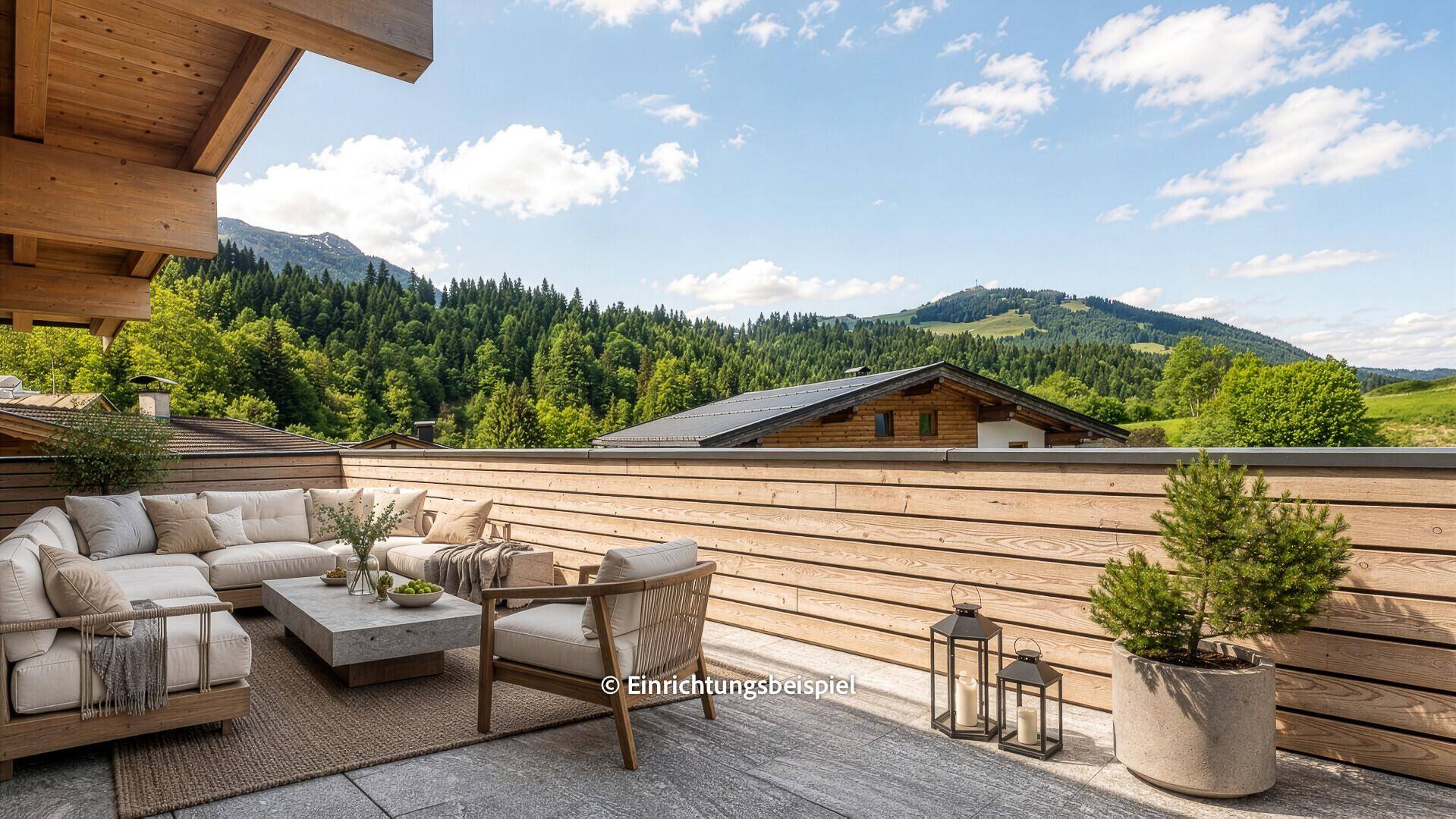 Geräumige Terrasse mit bequemen Loungemöbeln und atemberaubendem Blick auf die umliegenden Berge.