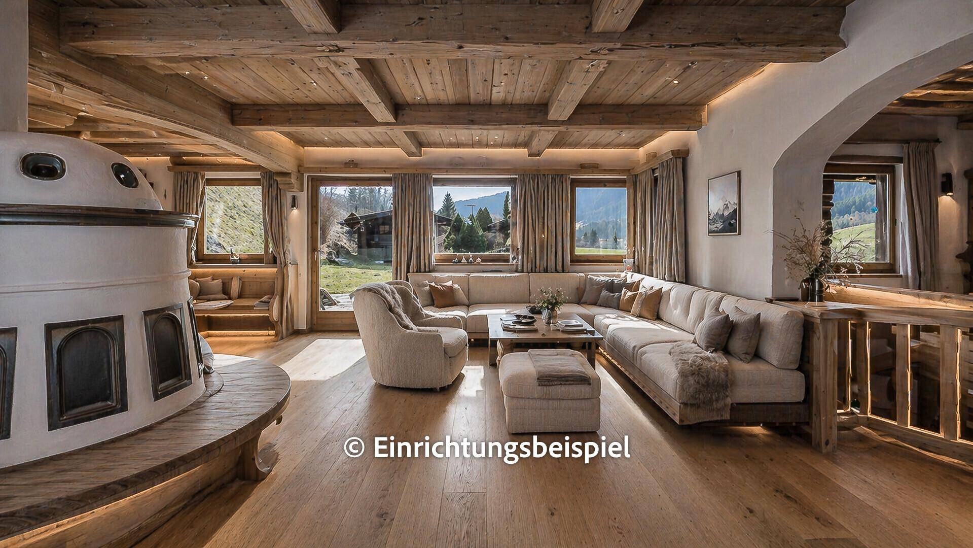 Modernisierter Wohn- und Essbereich mit Kachelofen, Holzbalkendecke und hellem Holzfußboden.