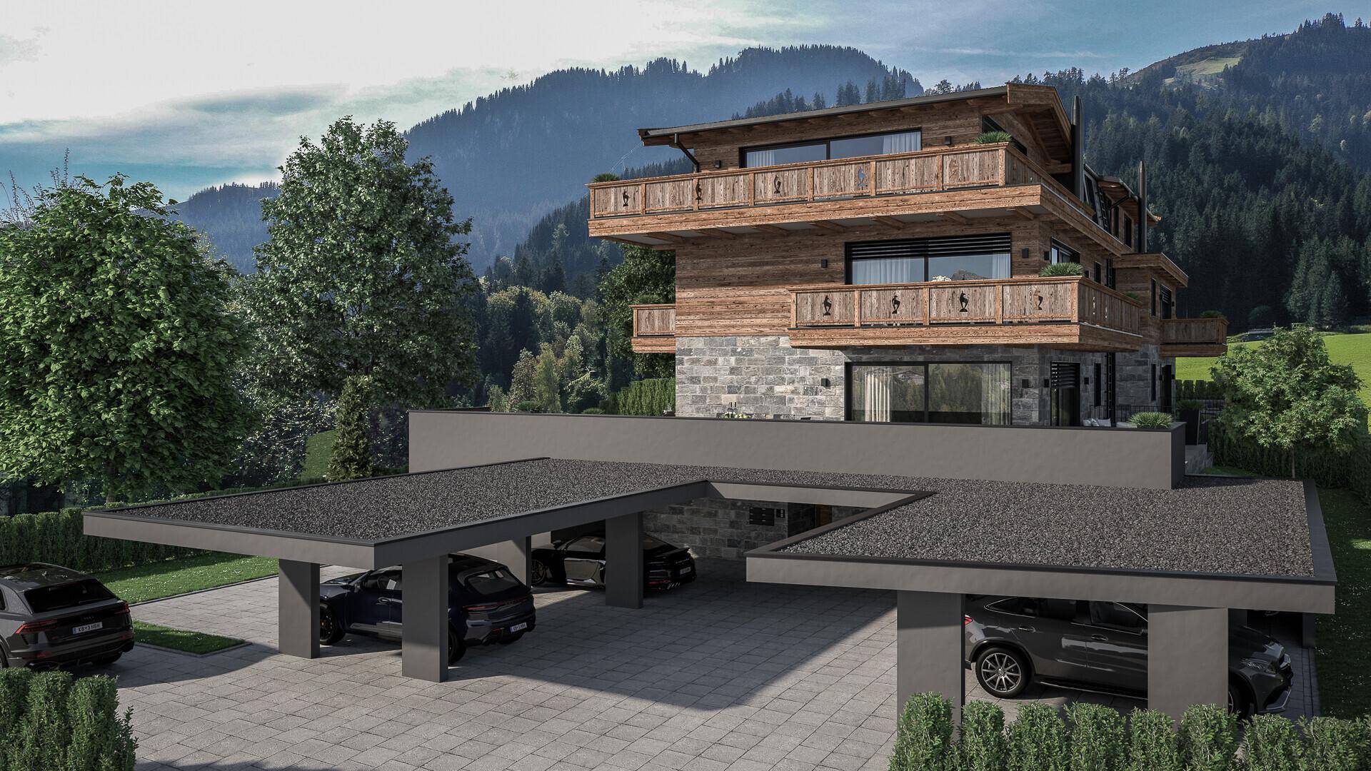 Alpines Neubauprojekt mit Holzfassade, Steinverkleidung und mehreren überdachten Carports.