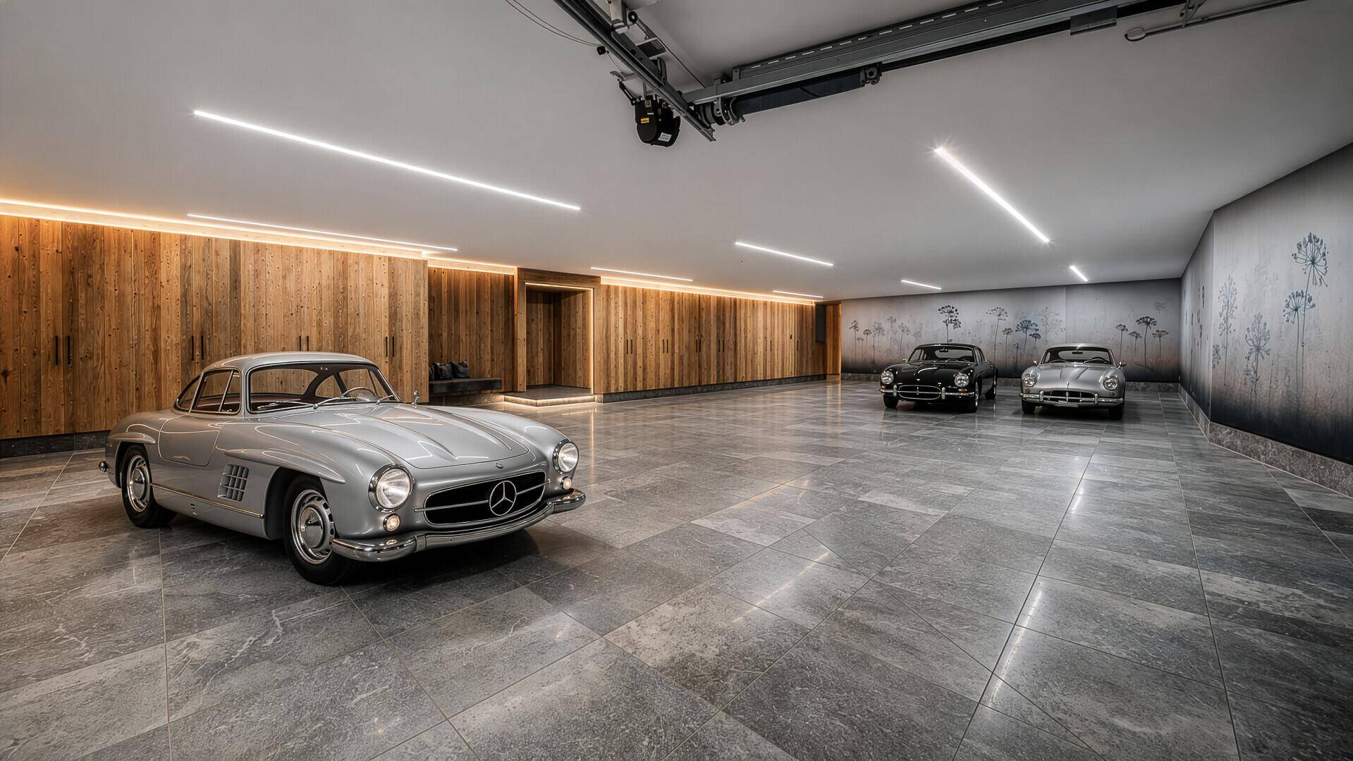 Geräumige Tiefgarage mit Platz für mehrere Oldtimer und moderner Beleuchtung.