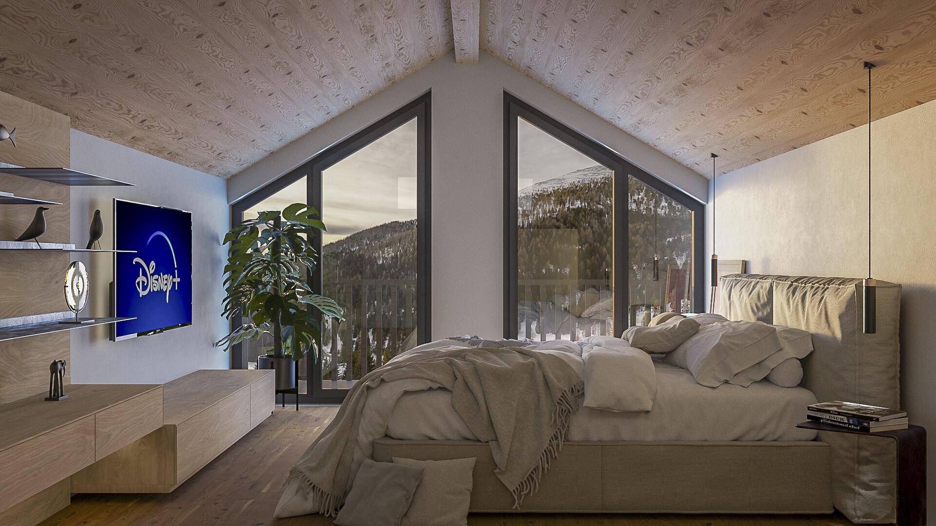 Gemütliches Schlafzimmer mit Holzdachschräge, großem Bett und bodentiefen Fenstern mit Bergblick.