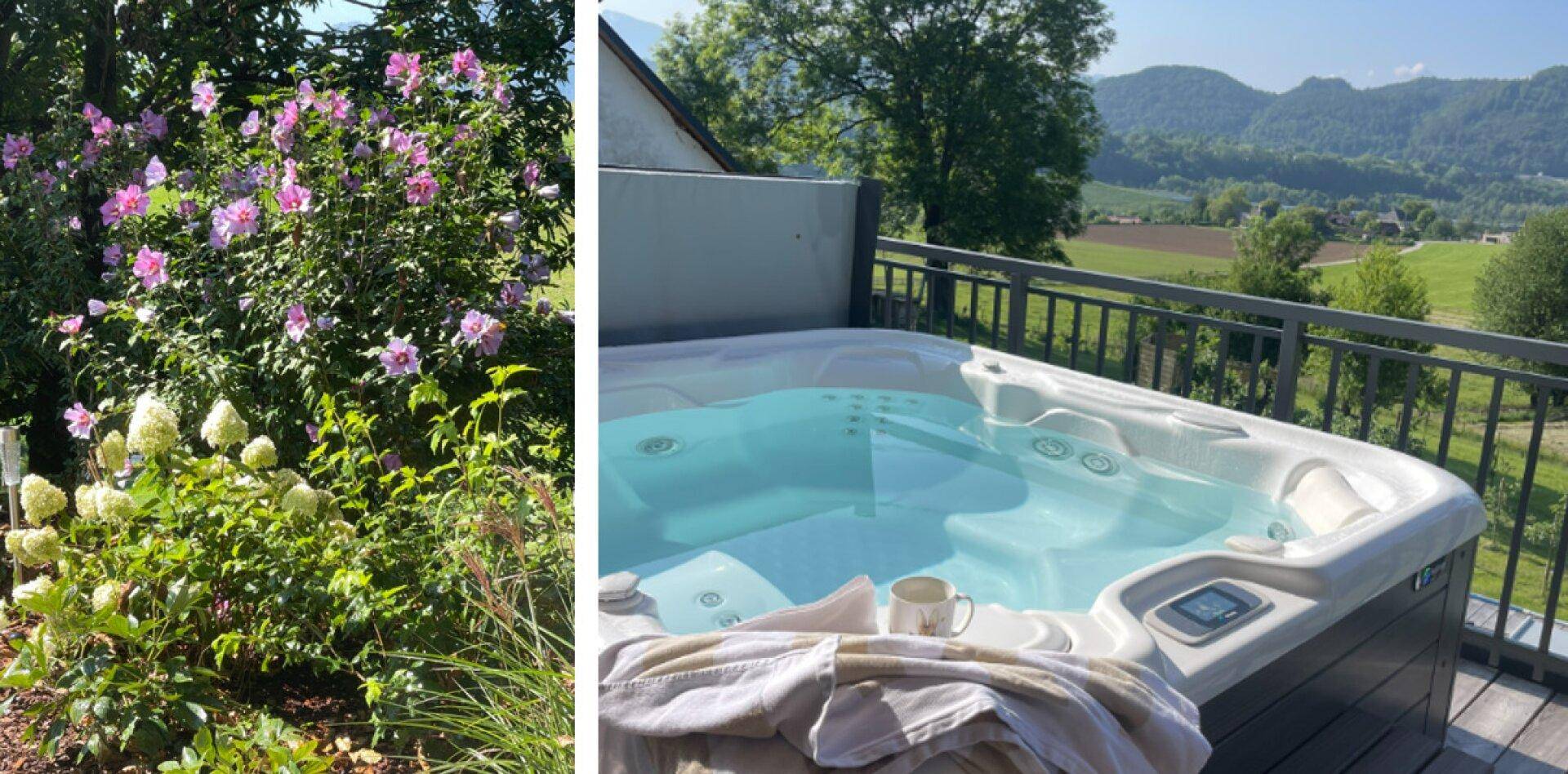 Entspannender Whirlpool auf dem Balkon mit weitem Blick über die grüne Landschaft und die Berge.