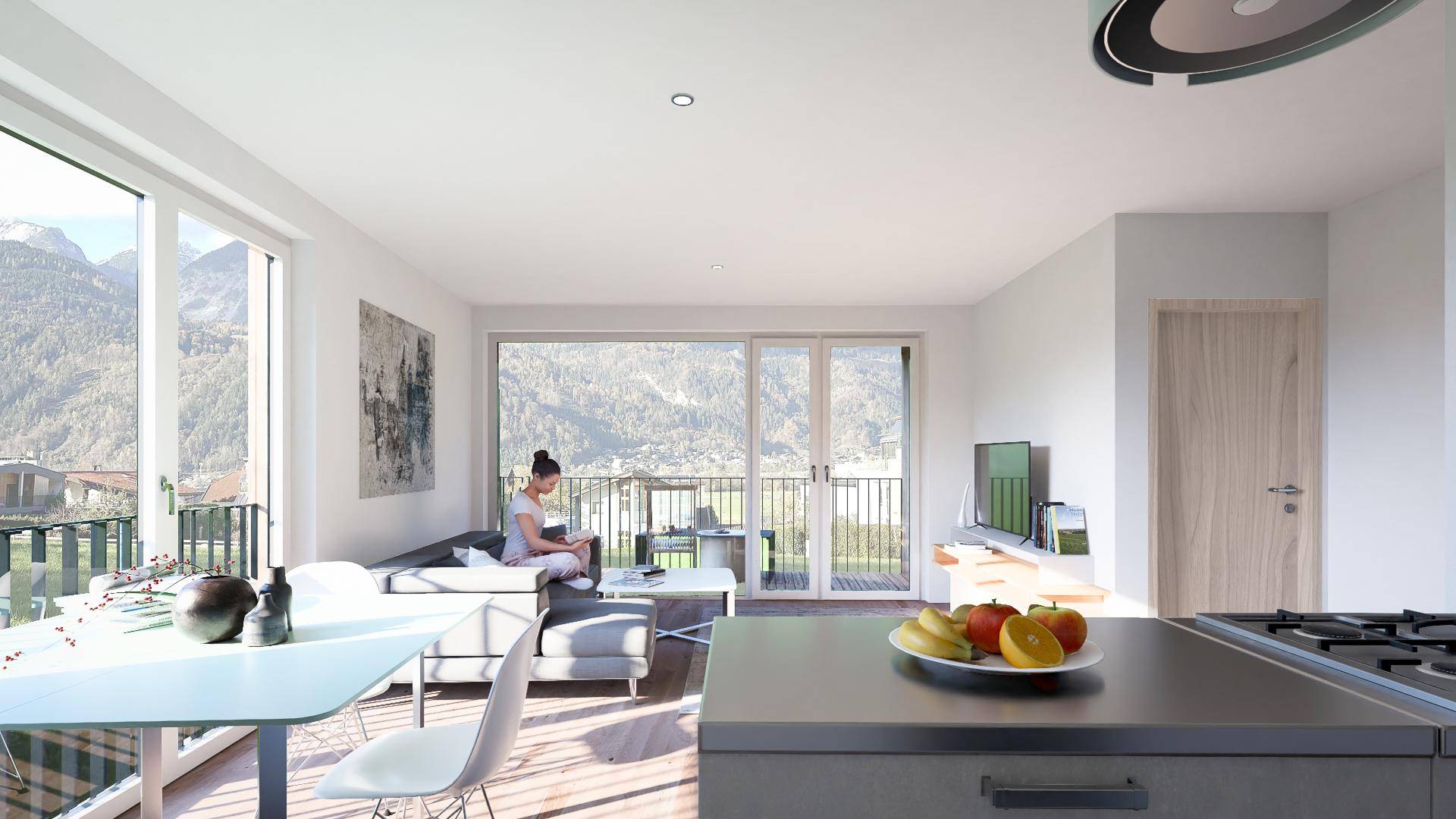 Offener Wohnbereich mit Küche, Holzboden, Bergblick und Zugang zum Balkon.