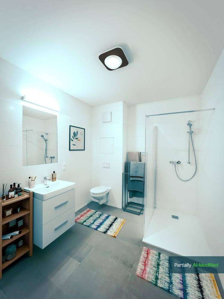 Modernes Badezimmer mit ebenerdiger Dusche, Wand-WC und großformatigen Fliesen.