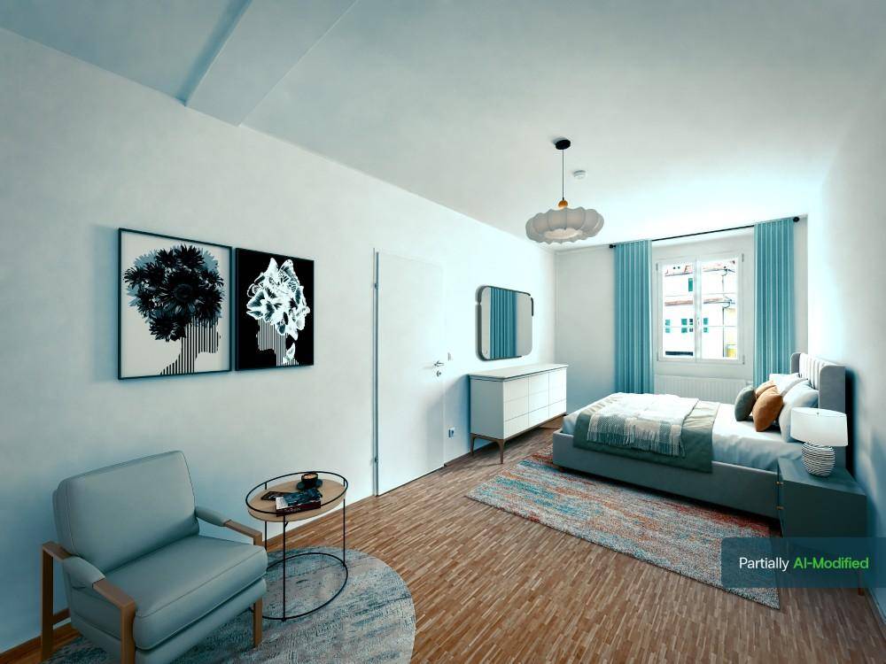 Geräumiges Schlafzimmer mit Parkettboden, bequemen Bett und moderner Einrichtung.