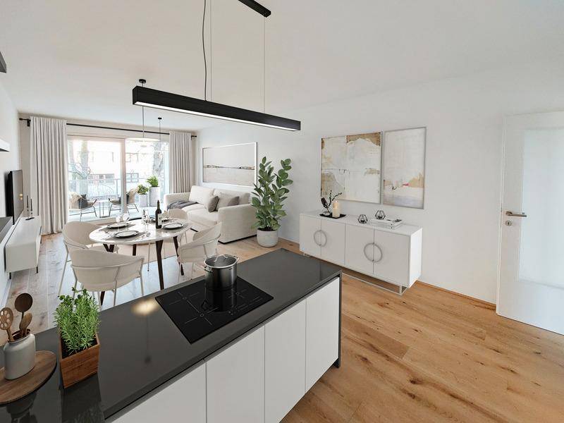 Heller, offener Wohn-Essbereich mit moderner Küche, Holzboden und Zugang zu einem Balkon.