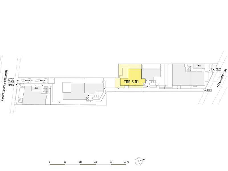 Lageplan der Wohnanlage mit Hervorhebung einer Einheit und Zufahrt zur Tiefgarage.