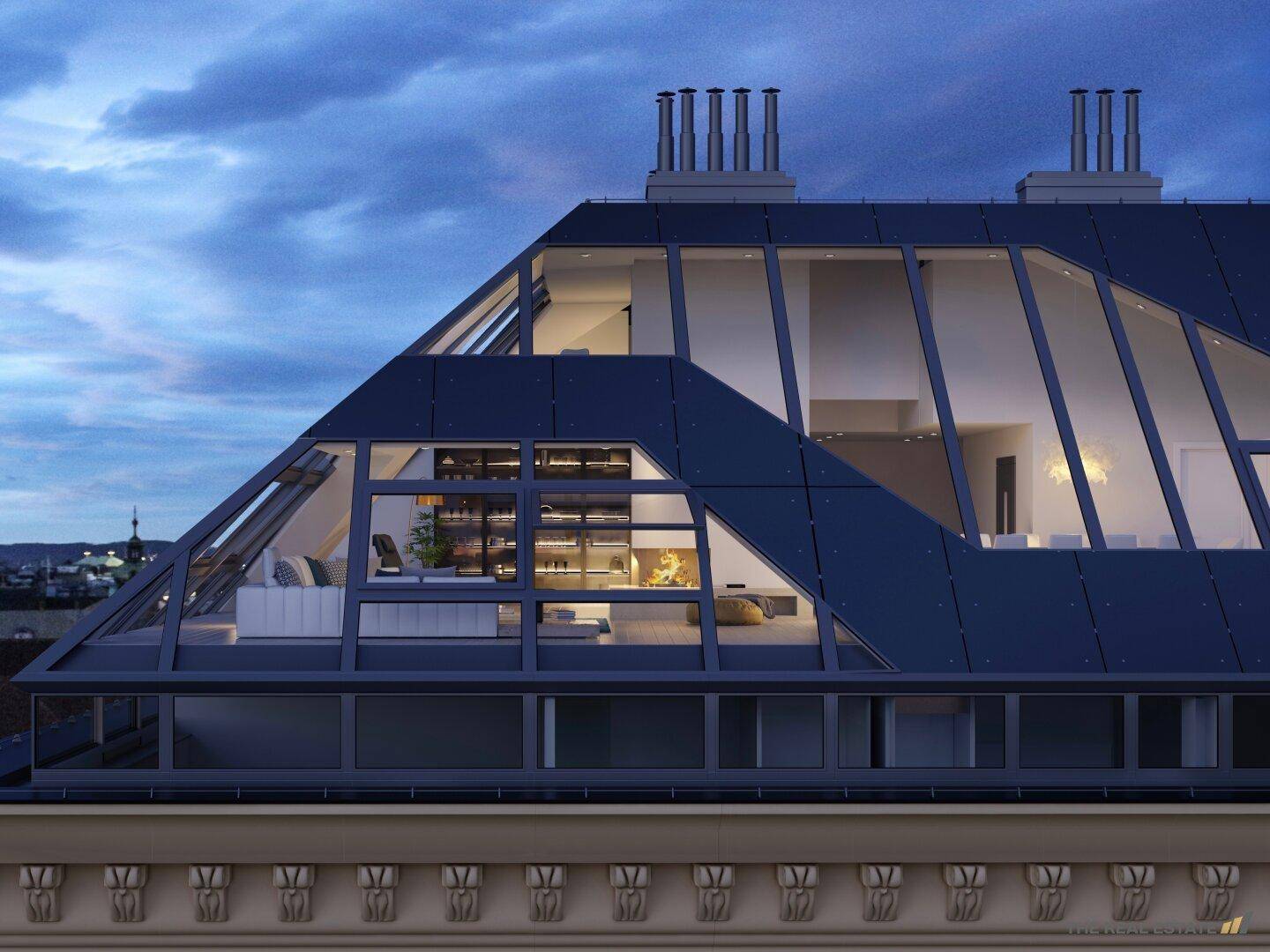 Ansicht des modernen Dachgeschosses bei Nacht, das durch große Fenster Einblicke in die Innenräume gewährt.