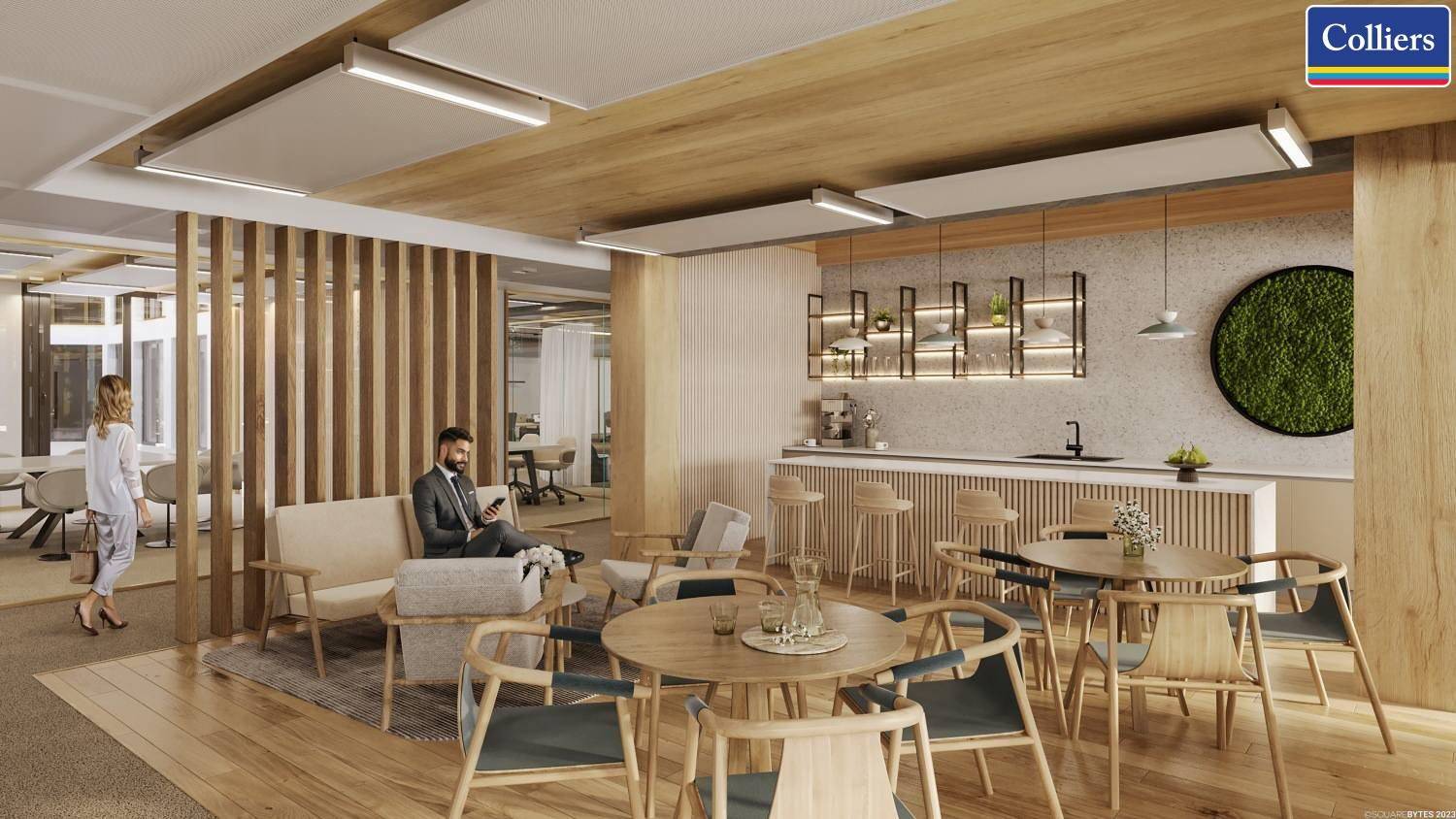 Gemütlicher Pausenraum mit Tischen, Stühlen, einer Lounge-Ecke und einer modernen Küchenzeile.