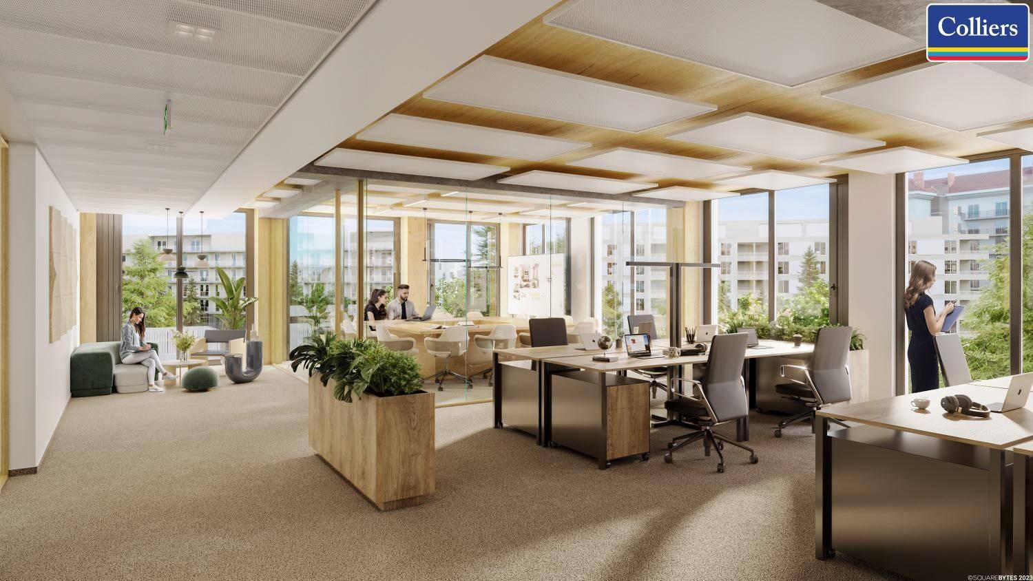 Helles Großraumbüro mit individuellen Arbeitsplätzen und einem entspannten Loungebereich, ideal für moderne Arbeit.