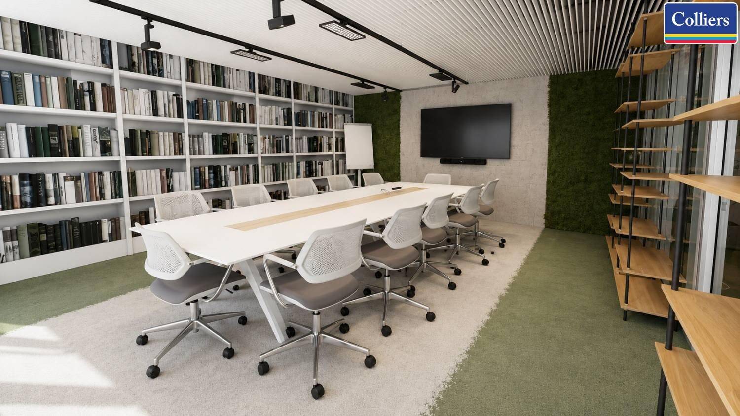Moderner Konferenzraum mit langem Tisch, Bücherregalen und grüner Wandgestaltung.