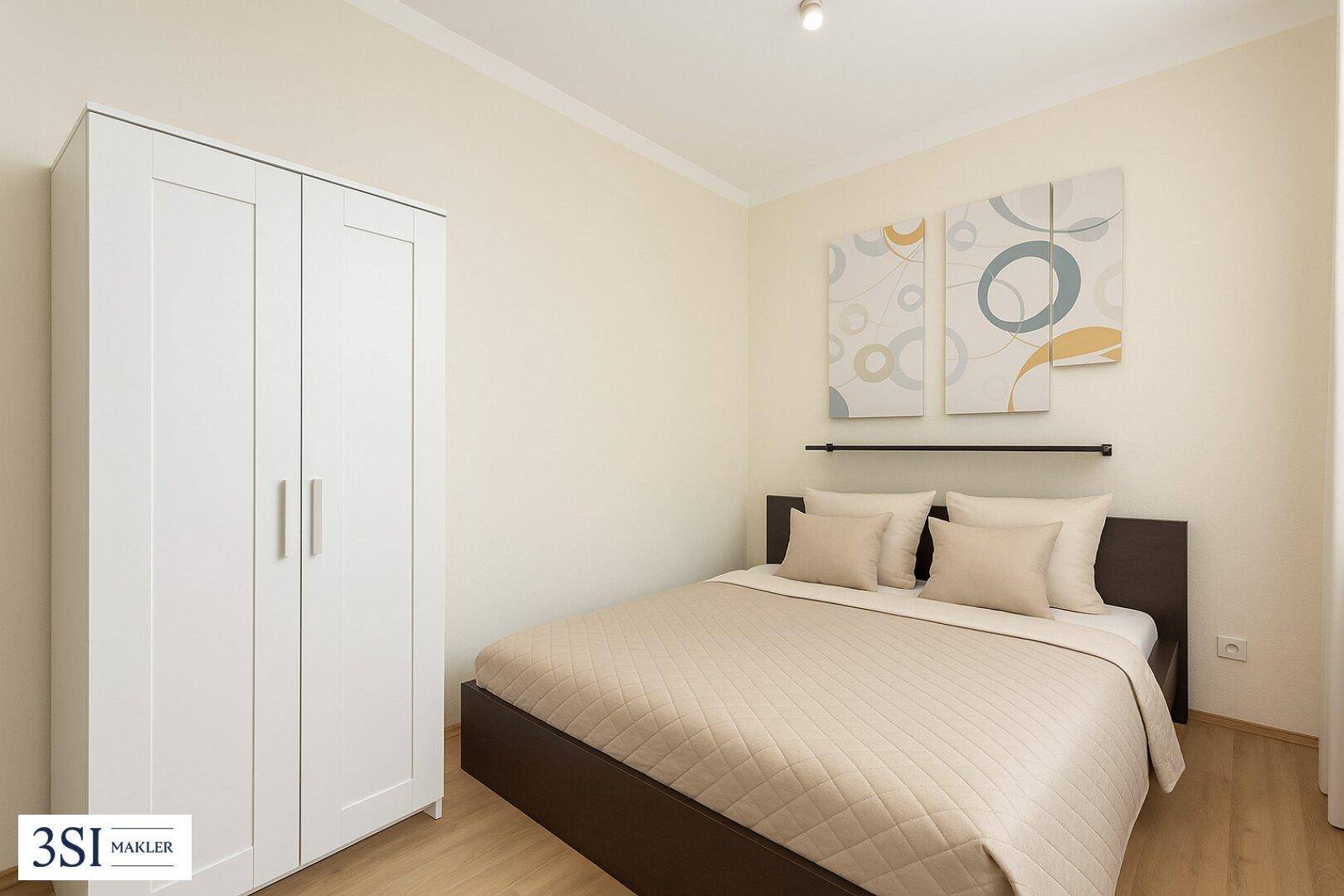 Gemütliches Schlafzimmer mit Doppelbett, weißem Kleiderschrank und Holzboden, dekoriert mit modernen Bildern.