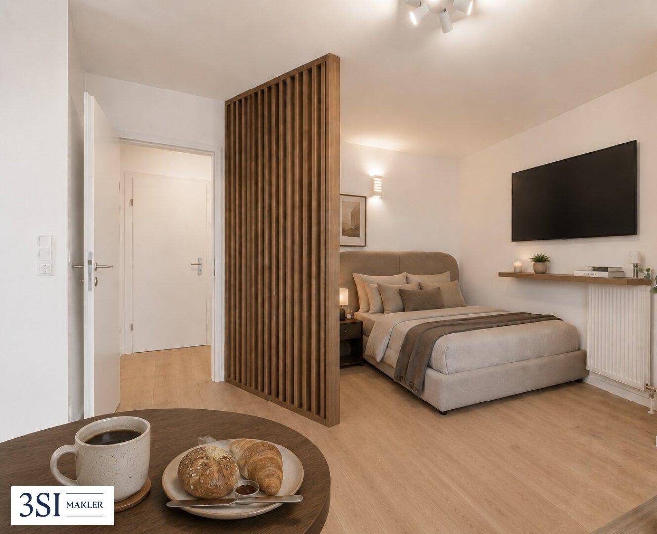 Schlafbereich eines modernen Studio-Apartments, abgetrennt durch eine stilvolle Holzlamellenwand, mit Zugang zum Flur.