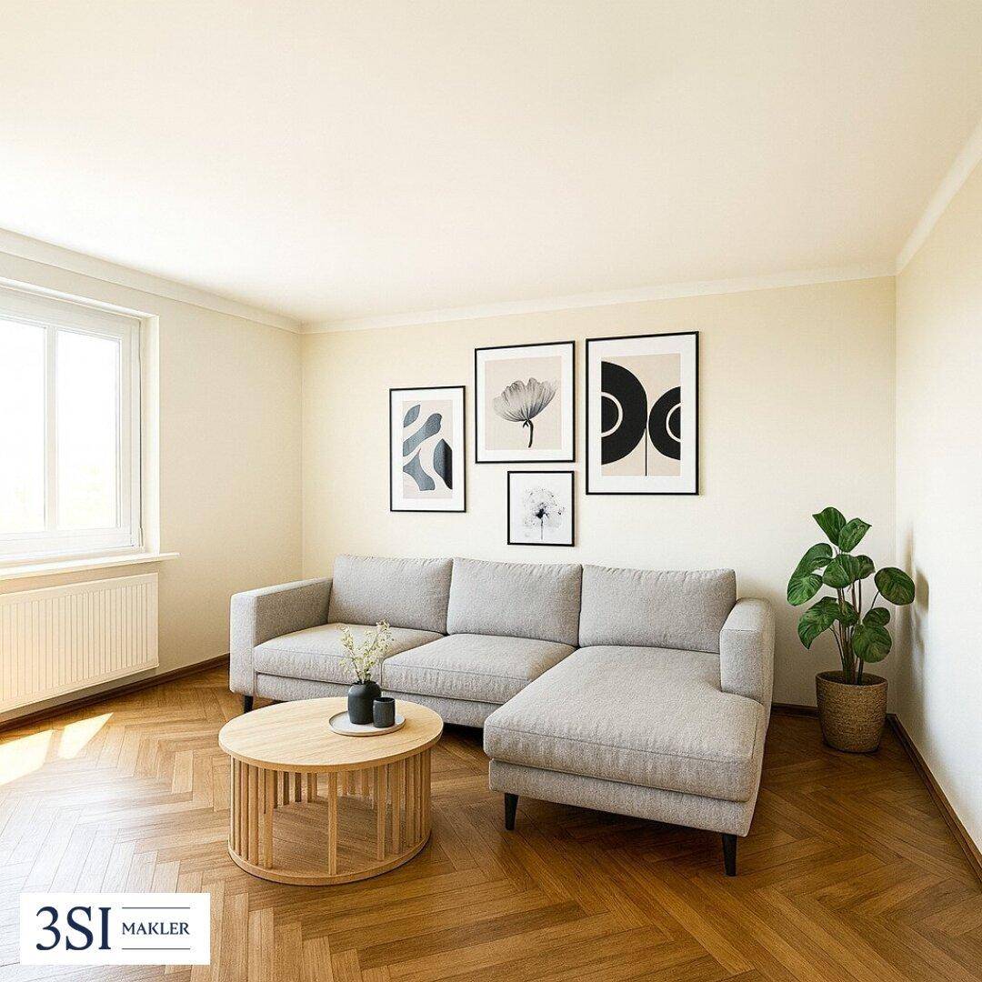 Gemütliches Wohnzimmer mit hellem L-förmigem Sofa, rundem Holztisch und modernen Kunstwerken an der Wand.