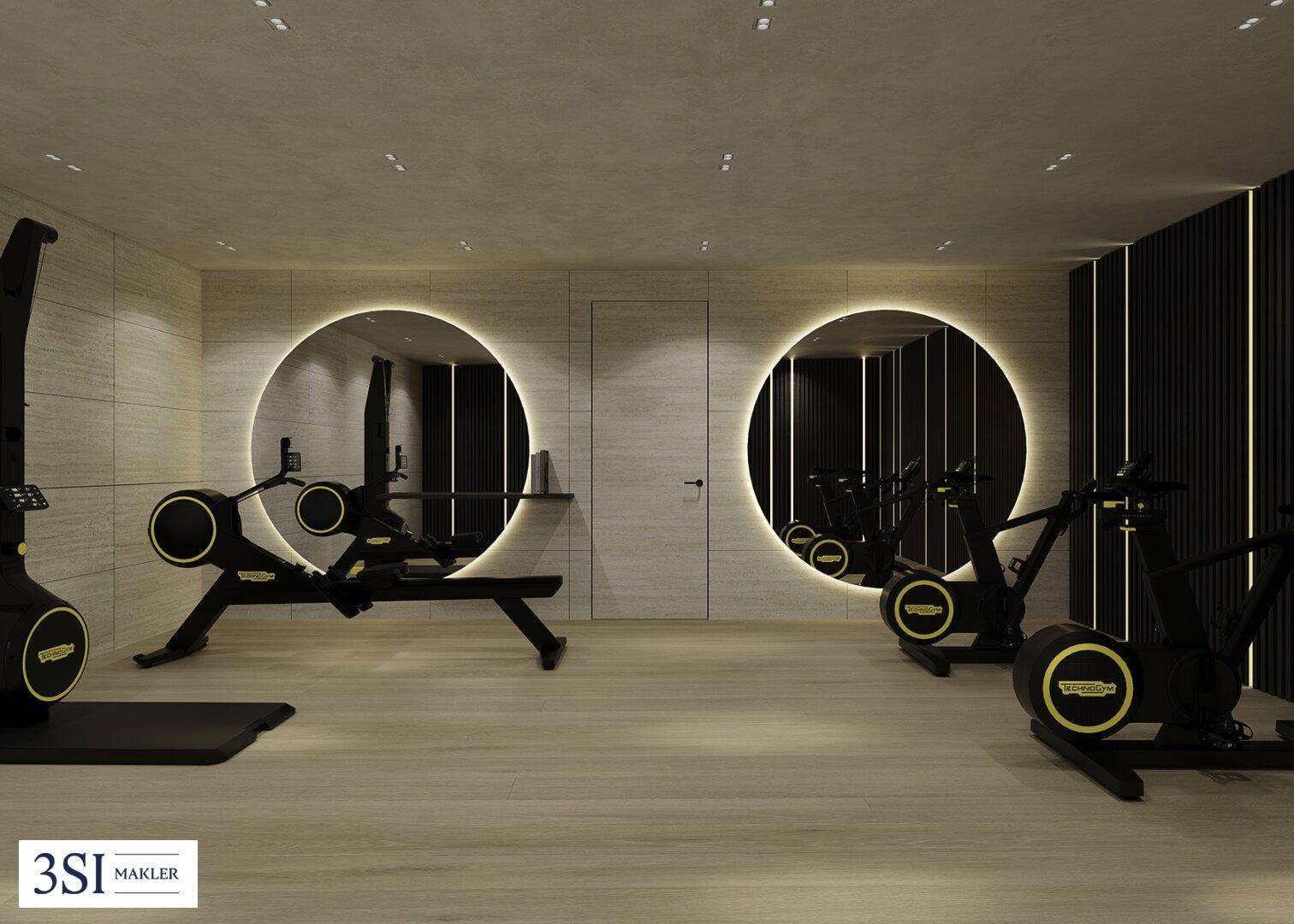Modernes Fitnessstudio mit hochwertigen Geräten, stilvoller Beleuchtung und hellen Holzböden.