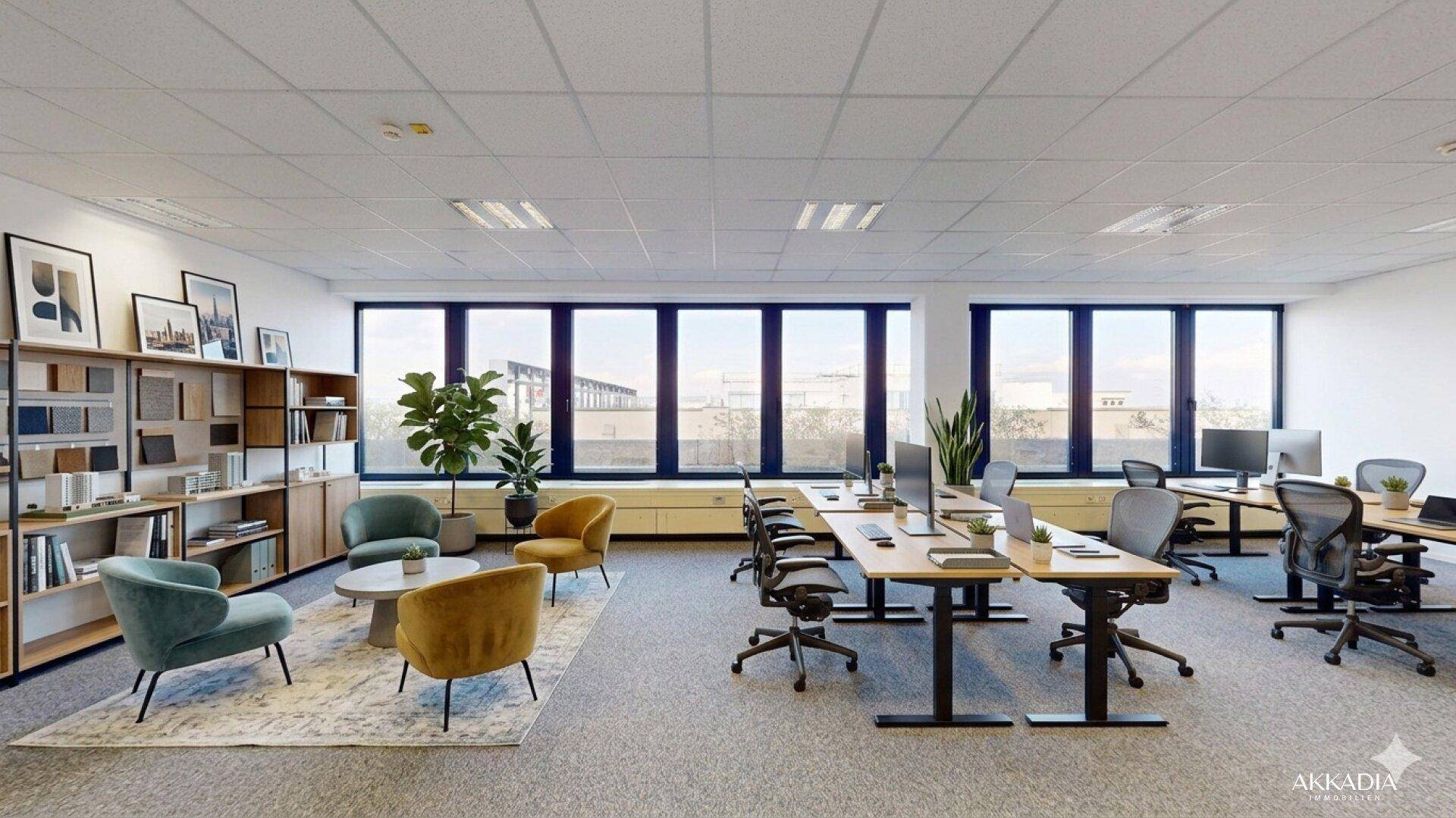 Stilvoll möblierter Büroraum mit Arbeitsplätzen, Lounge-Bereich und Bücherregalen für eine angenehme Atmosphäre.
