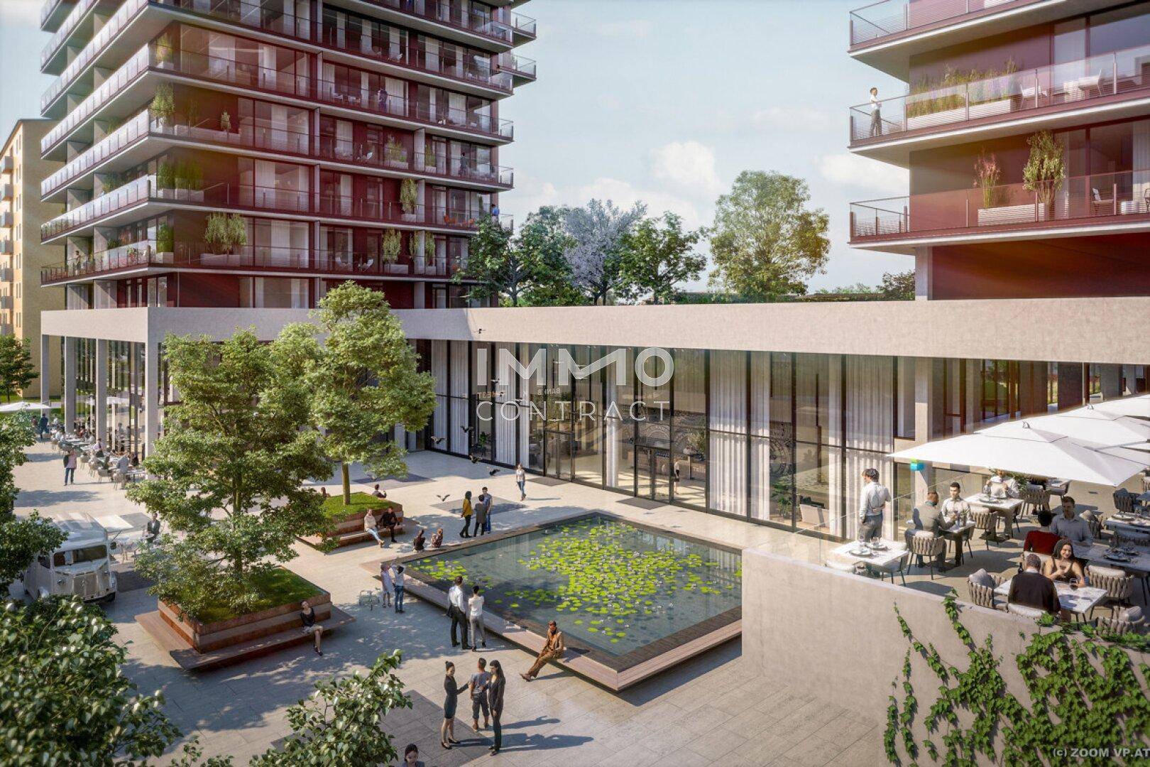 Moderne Wohnanlage mit Außenbereich, Wasserbecken und Cafés im Freien.