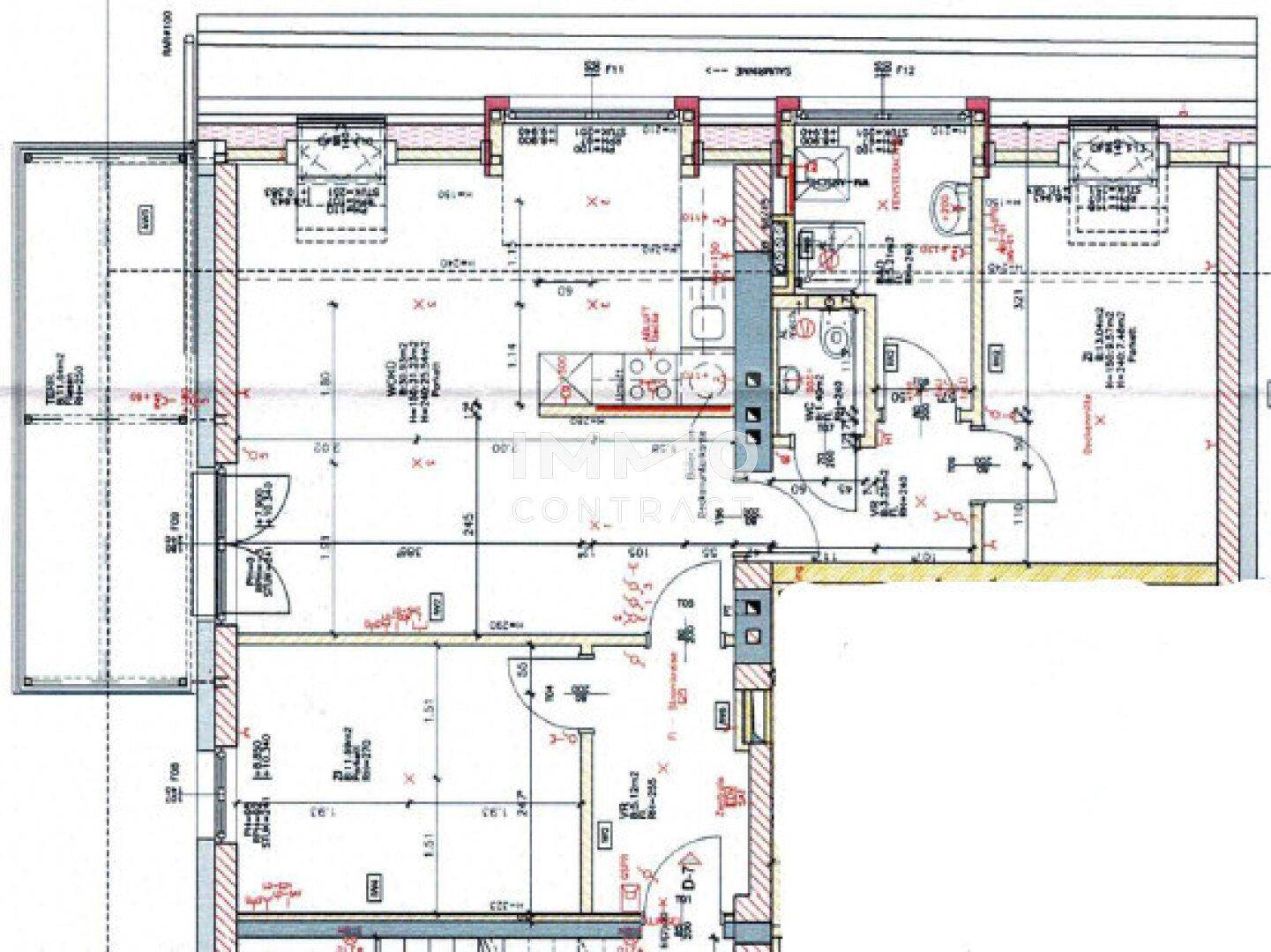 Grundriss einer Wohnung mit Terrasse, Bad, WC und offener Küche.