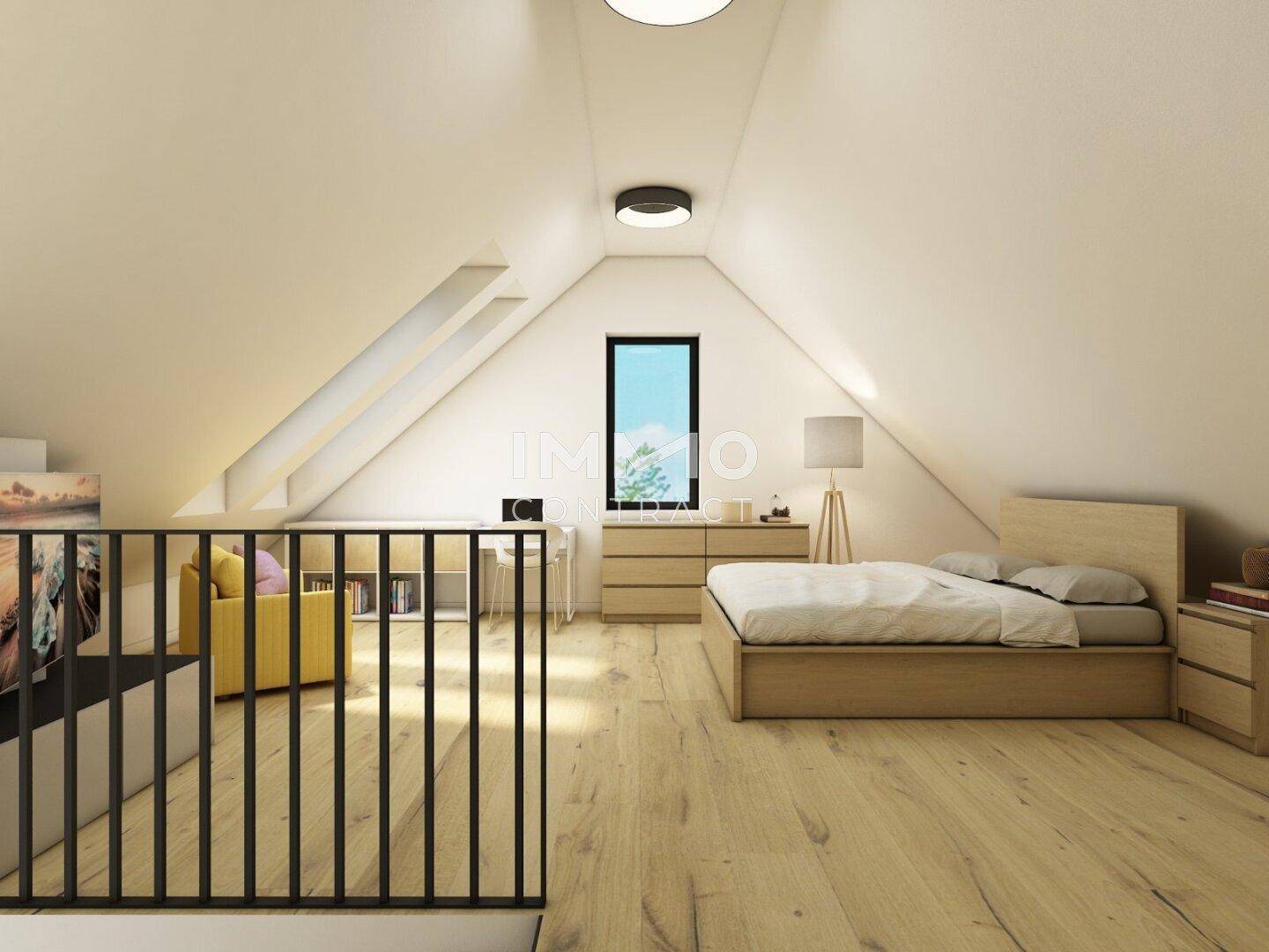 Helles Dachgeschosszimmer mit Holzboden, Schreibtisch und Schlafbereich.