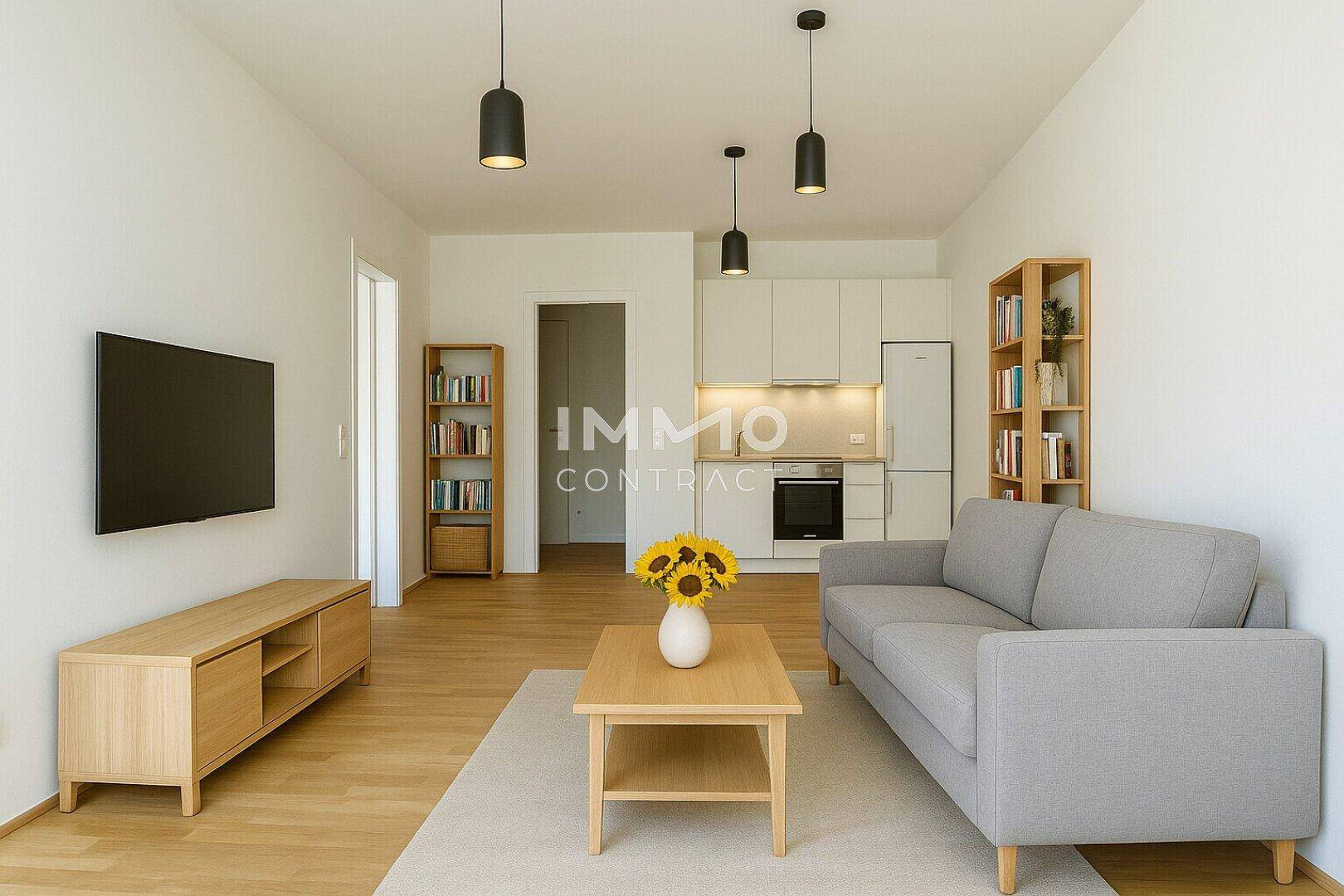 Heller offener Wohn-Essbereich mit integrierter Küchenzeile, Sofa und modernen Möbeln.