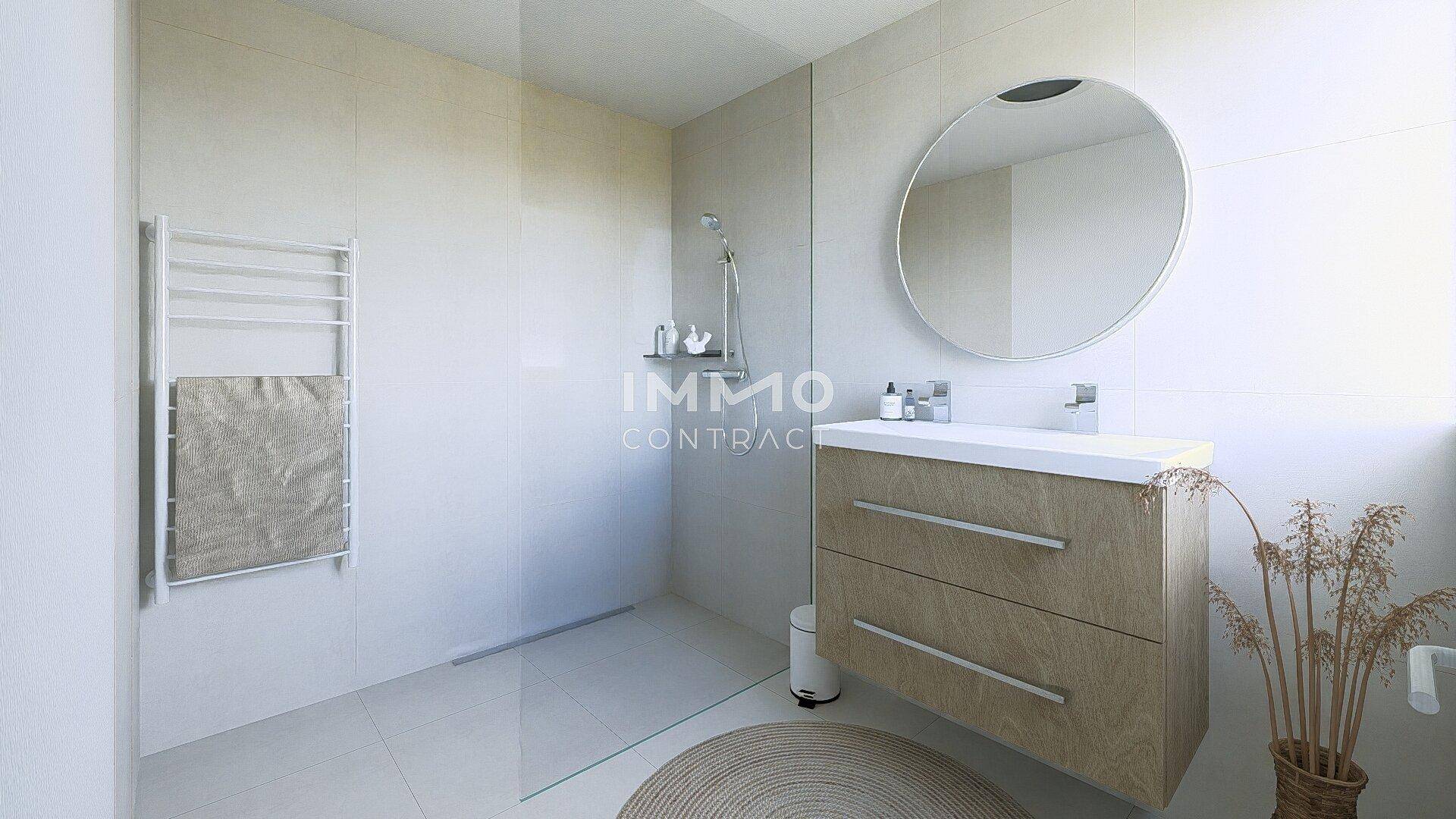 Modernes Badezimmer mit begehbarer Dusche, Einzelwaschbecken und beheiztem Handtuchhalter.