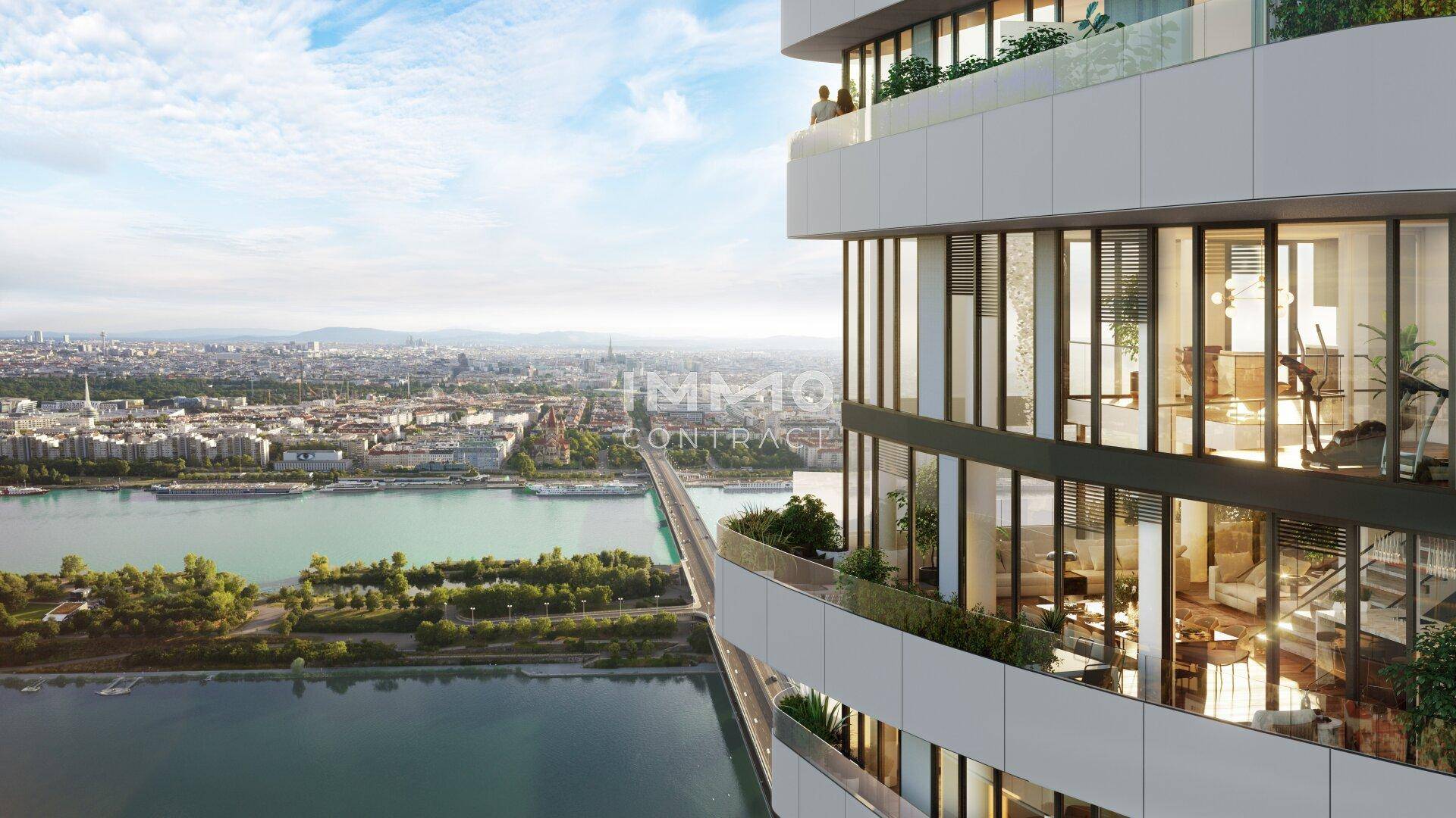 Moderne Hochhausfassade mit geschwungenen Balkonen und weitem Blick über die Stadt und den Fluss.