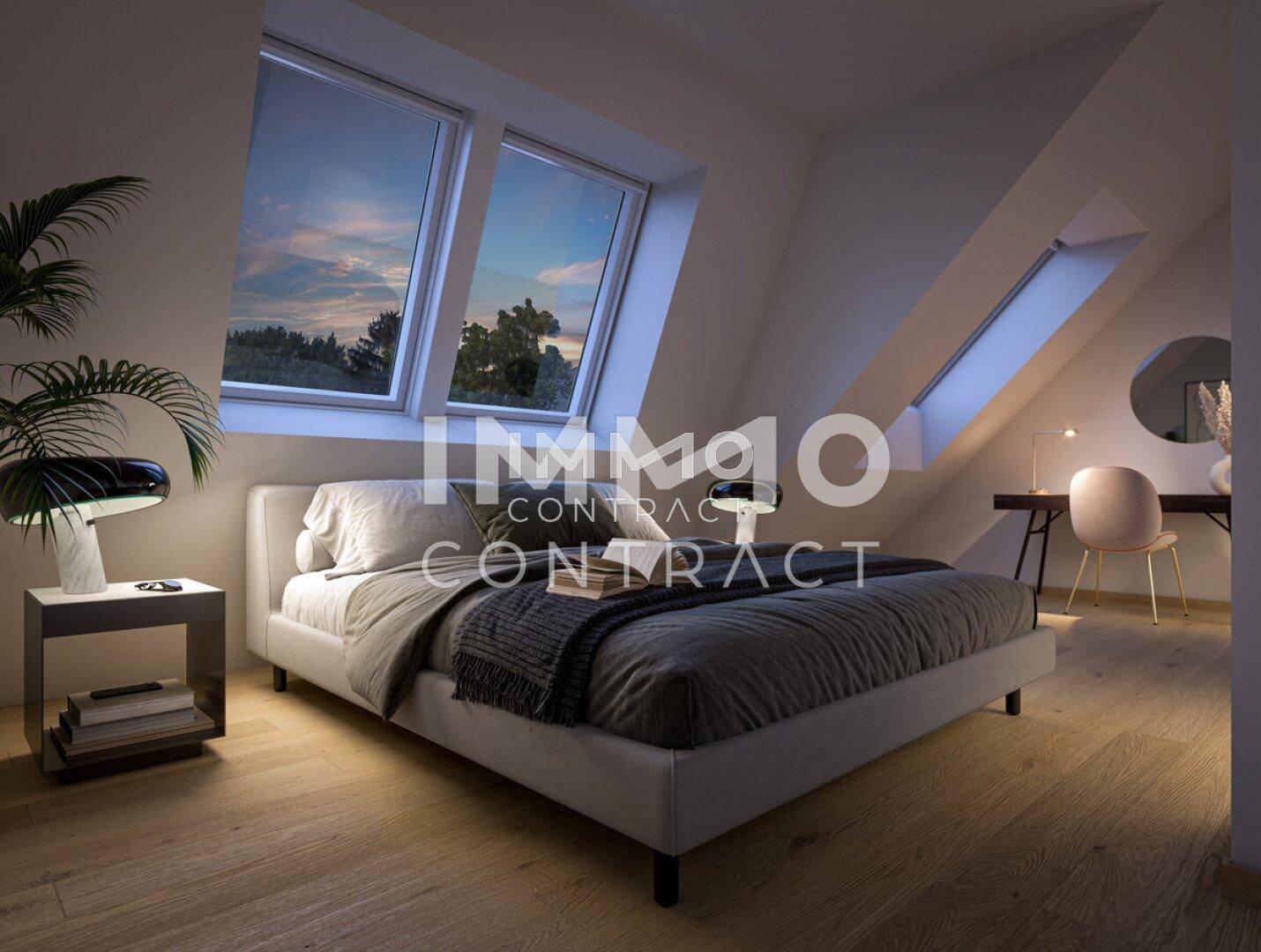 Gemütliches Schlafzimmer im Dachgeschoss mit großen Dachfenstern und Holzboden.