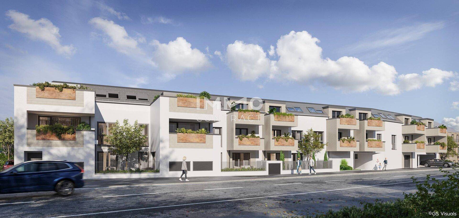 Ansicht der modernen Wohngebäude von der Straße mit Balkonen und großen Fenstern.