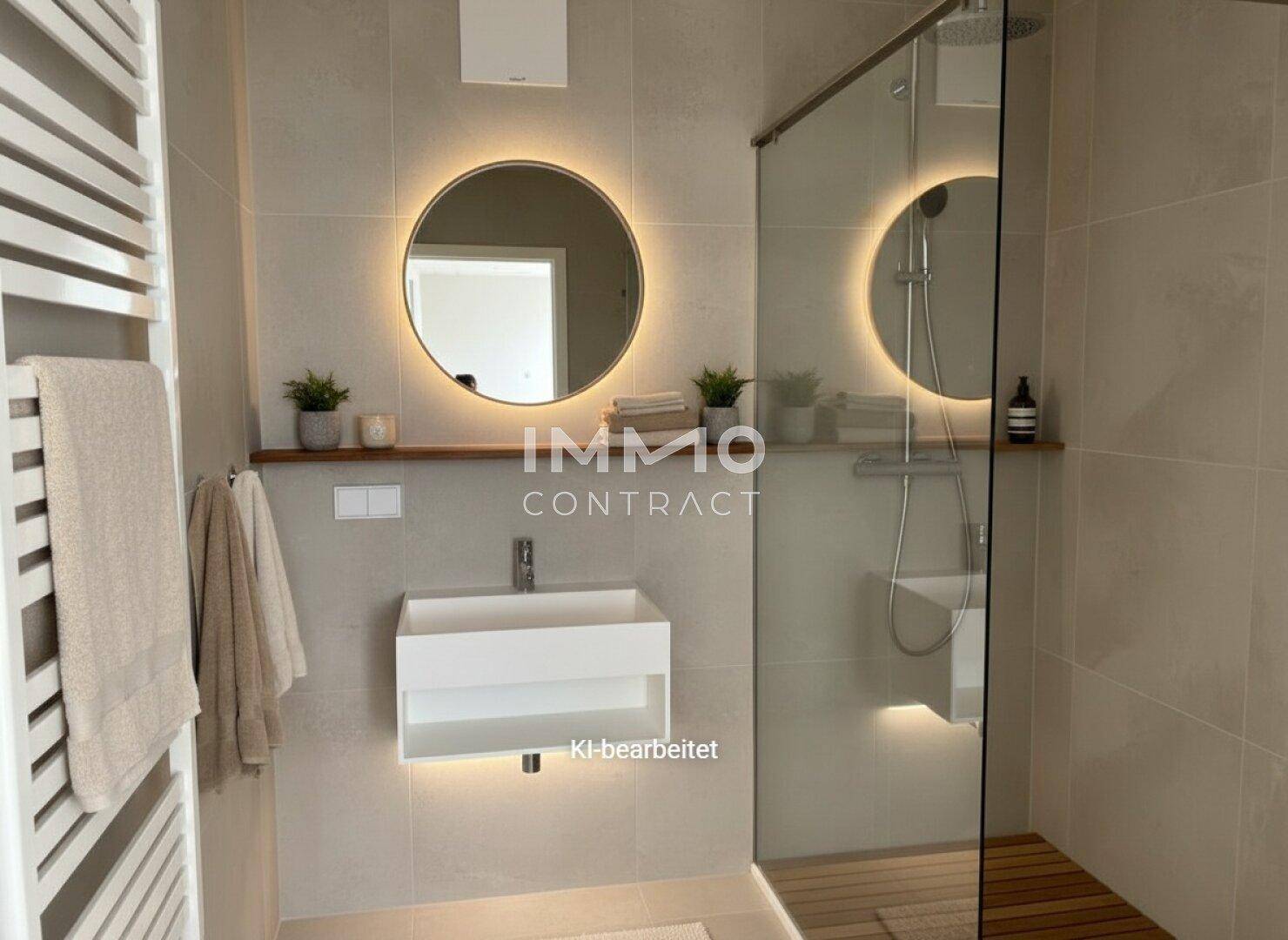 Modernes Badezimmer mit beleuchtetem Spiegel, schwebendem Waschtisch und ebenerdiger Dusche.