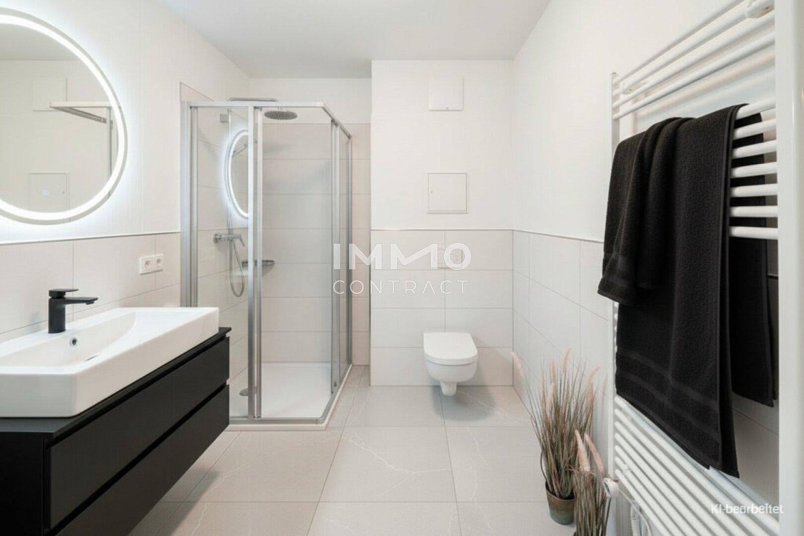 Modernes Badezimmer mit ebenerdiger Dusche, Wand-WC und beheiztem Handtuchhalter.