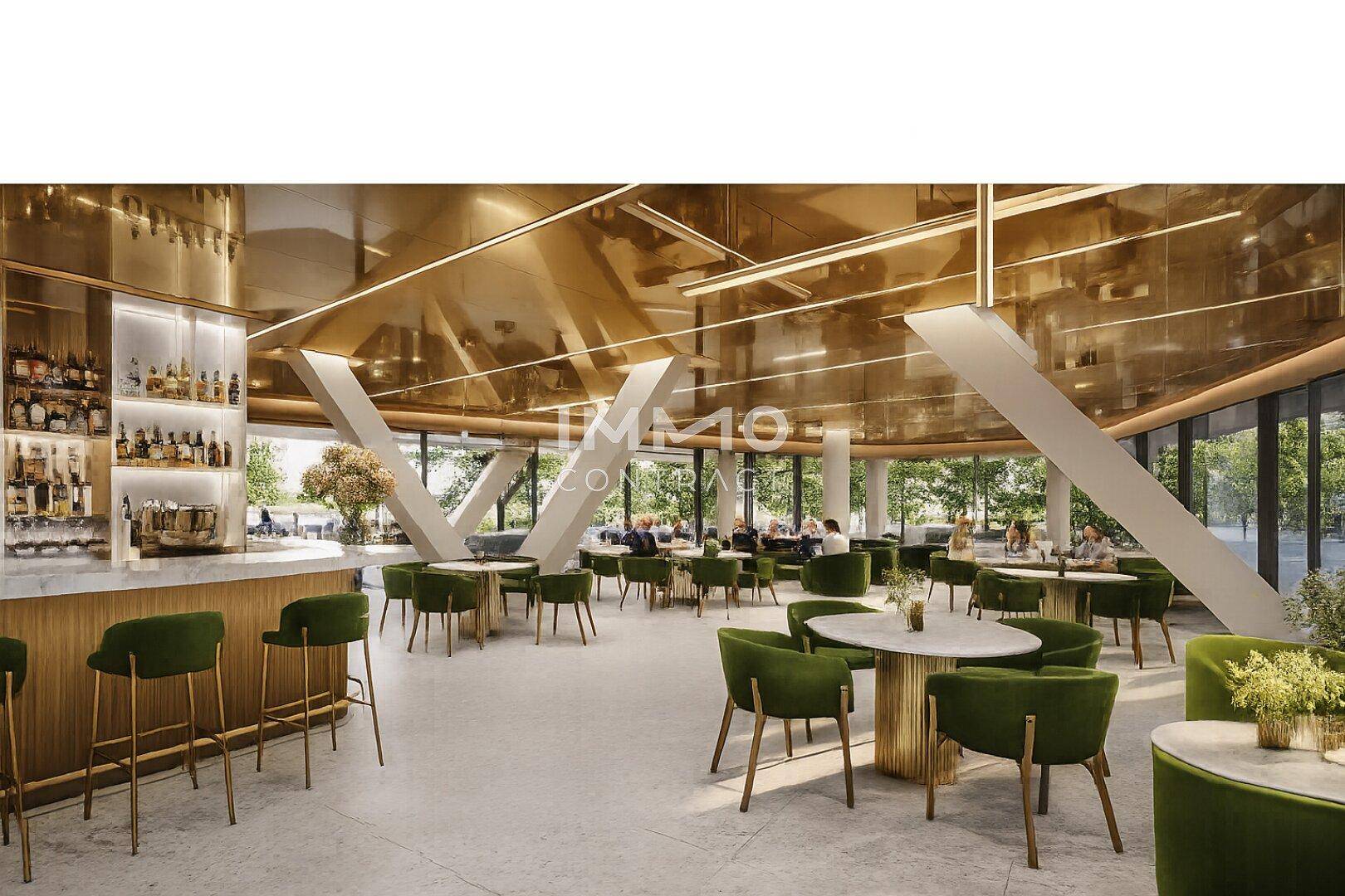Stilvolle Bar und Lounge-Bereich mit grünen Sitzgelegenheiten, einer Marmorbar und goldener Decke.