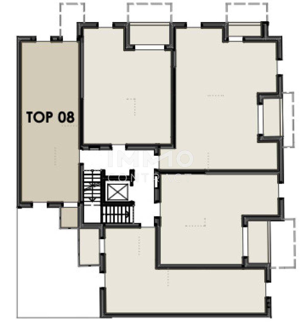 Grundriss eines Stockwerks mit Treppenhaus, Aufzug und mehreren Wohneinheiten.