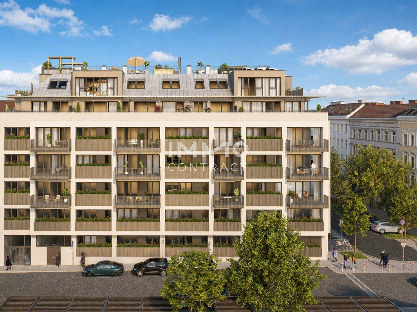 Moderne Wohngebäude-Fassade mit Balkonen und großen Fenstern an einer städtischen Straße.